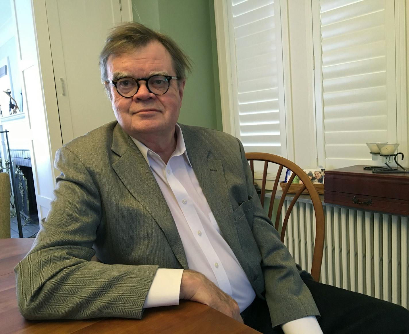 FILE - In this, Feb. 23, 2018, file photo, Garrison Keillor poses for a photo in Minneapolis. An appearance by Keillor, former host of "A Prairie Home Companion,&#x201d; at a Vermont book festival has been canceled after public outcry. Burlington Book Festival Founding Director Rick Kisonak confirmed to Vermont Public Radio that the Oct. 14 fundraising event would not take place. (AP Photo/Jeff Baenen, File)