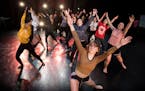Students from North and Southwest High Schools, including Jess Nelson a junior at Southwest, center, rehearse their dance.