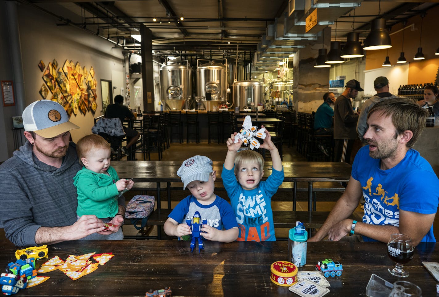 Nic Sabatke, left, with his daughter Mae, 1, and son Anders, 3, attends a Twin Cities Dads playgroup at Omni Brewing in Maple Grove with Keith Nagel, right, and his son Sawyer, 3. ] LEILA NAVIDI &#x2022; leila.navidi@startribune.com BACKGROUND INFORMATION: A Twin Cities Dads playgroup met at Central Park and then Omni Brewing in Maple Grove on Friday, September 13, 2019