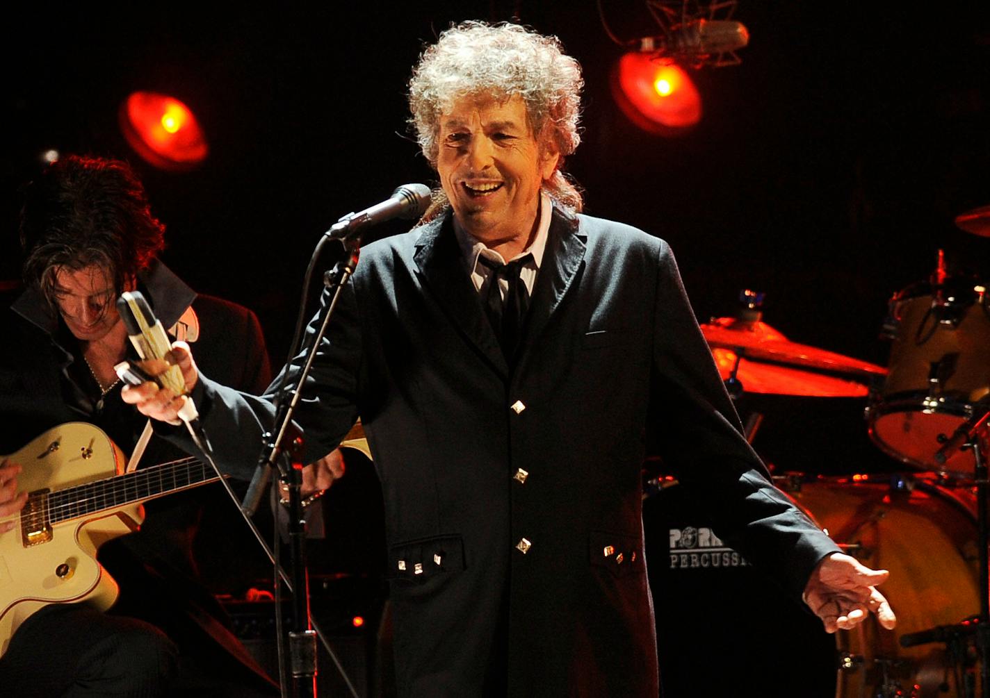 FILE - In this Jan. 12, 2012, file photo, Bob Dylan performs in Los Angeles. The music legend has quietly put concert tickets on sale for a tour in support of last year's album, "Rough and Rowdy Ways." His website bills it as a "World Wide Tour 2021-2024." (AP Photo/Chris Pizzello, File)