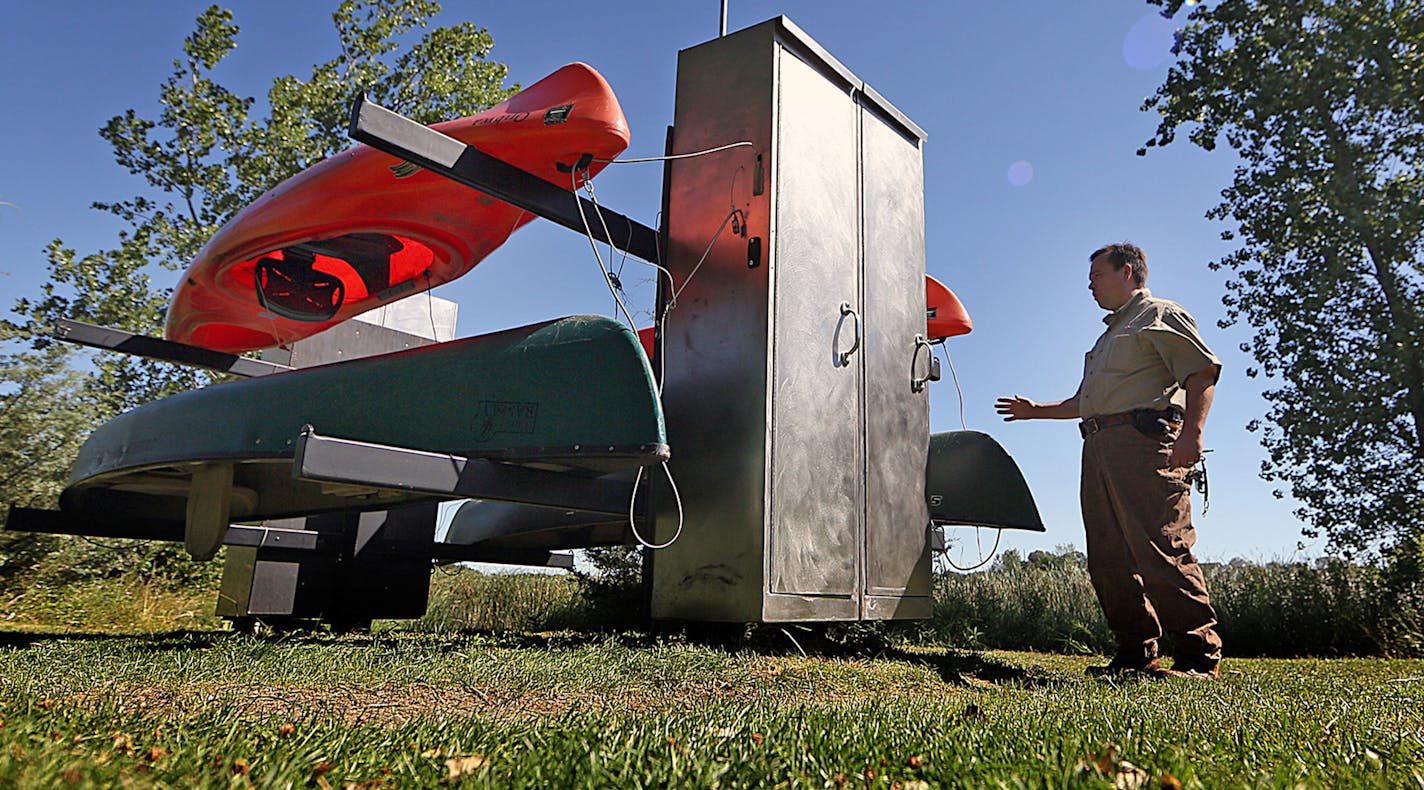 Two, three-person canoes and two one-person kayaks are available for use at no cost at Sunfish Lake Park in the City of Ramsey, where service technician R. David Corbet, recently checked the self-service kiosk. ] JIM GEHRZ &#xd4; james.gehrz@startribune.com / Ramsey, MN / July 29, 2015 / 10:00 AM &#xd2; BACKGROUND INFORMATION: The first Nice Ride-style canoe and mountain bike service is in the works! The city of Ramsey is partnering with the National Parks Service to open the bike and boat shari