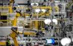 FILE - Articulated robots move inside the Hanwha Qcells Solar plant, Oct. 16, 2023, in Dalton, Ga. On Thursday, April 25, 2024, the U.S. government is