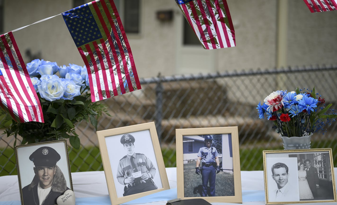 Photos of slain St. Paul Police Officer James Sackett were on display outside his home Friday on the 50th anniversary of his death in the line of duty. ] aaron.lavinsky@startribune.com Jeanette Sackett can't go one day without thinking about what she's lost. It's been 50 years since her police officer husband, James Sackett, was slain in an ambush, but the pain has not subsided. On Friday, St. Paul police and other law enforcement agencies commemorated the anniversary with a procession outside h