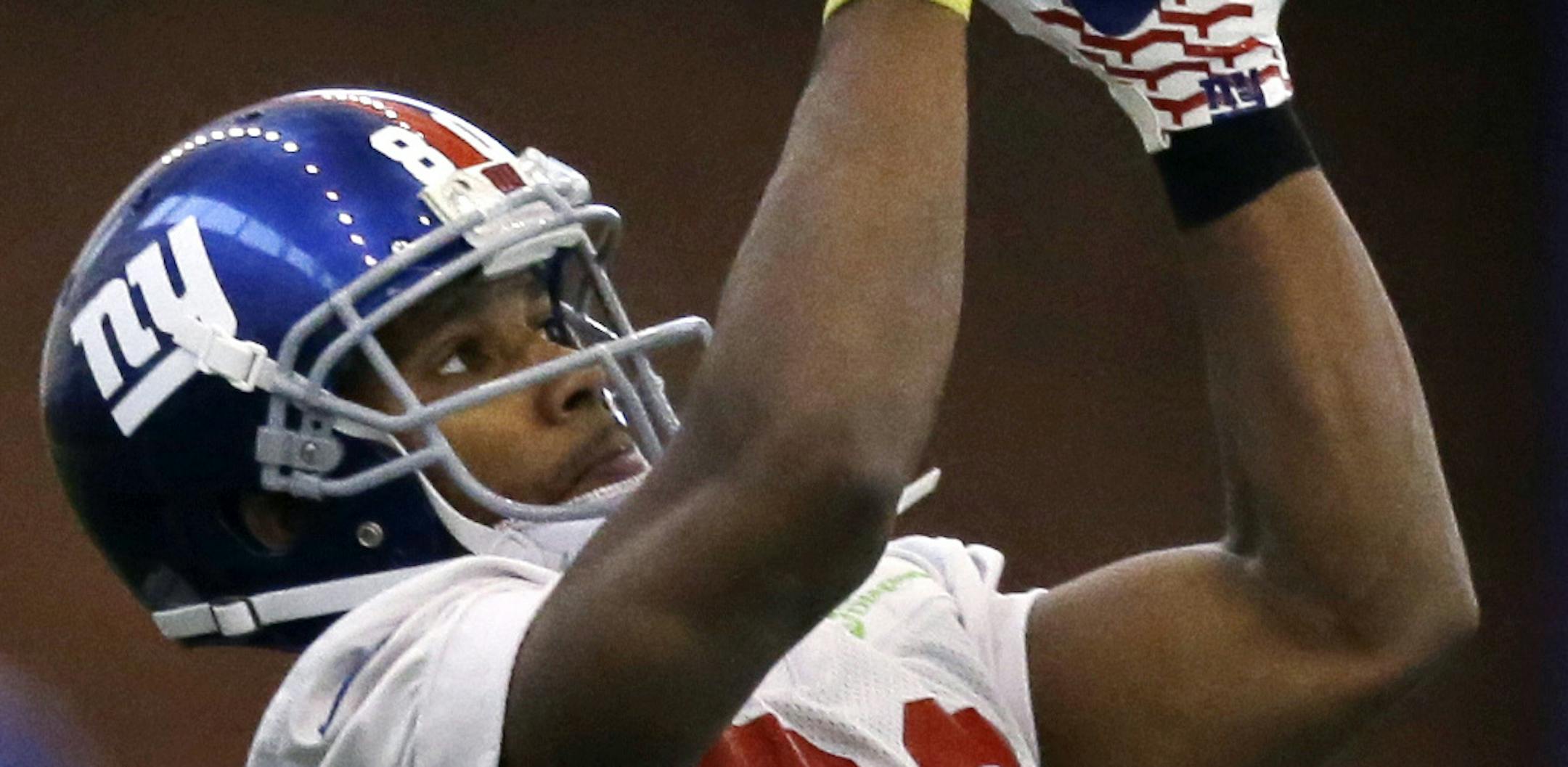 New York Giants wide receiver Victor Cruz (80) catches a pass during NFL football practice in East Rutherford, N.J., Wednesday, Nov. 20, 2013. AP Photo/Mel Evans)