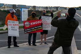 A supporter photographed a Retail, Wholesale and Department Store Union representative in late March outside the Amazon fulfillment warehouse at the c