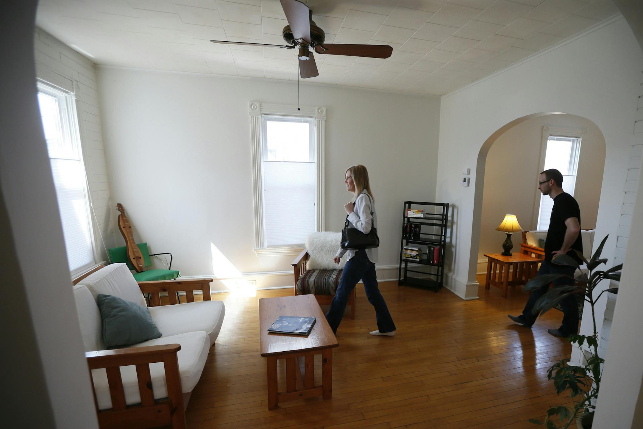 Kari and Kevin Heimer walked through an open house at 959 23rd AVe NE on Sunday. Jennifer Olstad of Keller Williams is hosting an open house at a property in Northeast Minneapolis that has been a rental for several years.With prices up, the owner of that house decided that now was a good time to sell. Sunday April 6, 2014 in Minneapolis , MN. ]JERRY HOLT jerry.holt@startribune.com