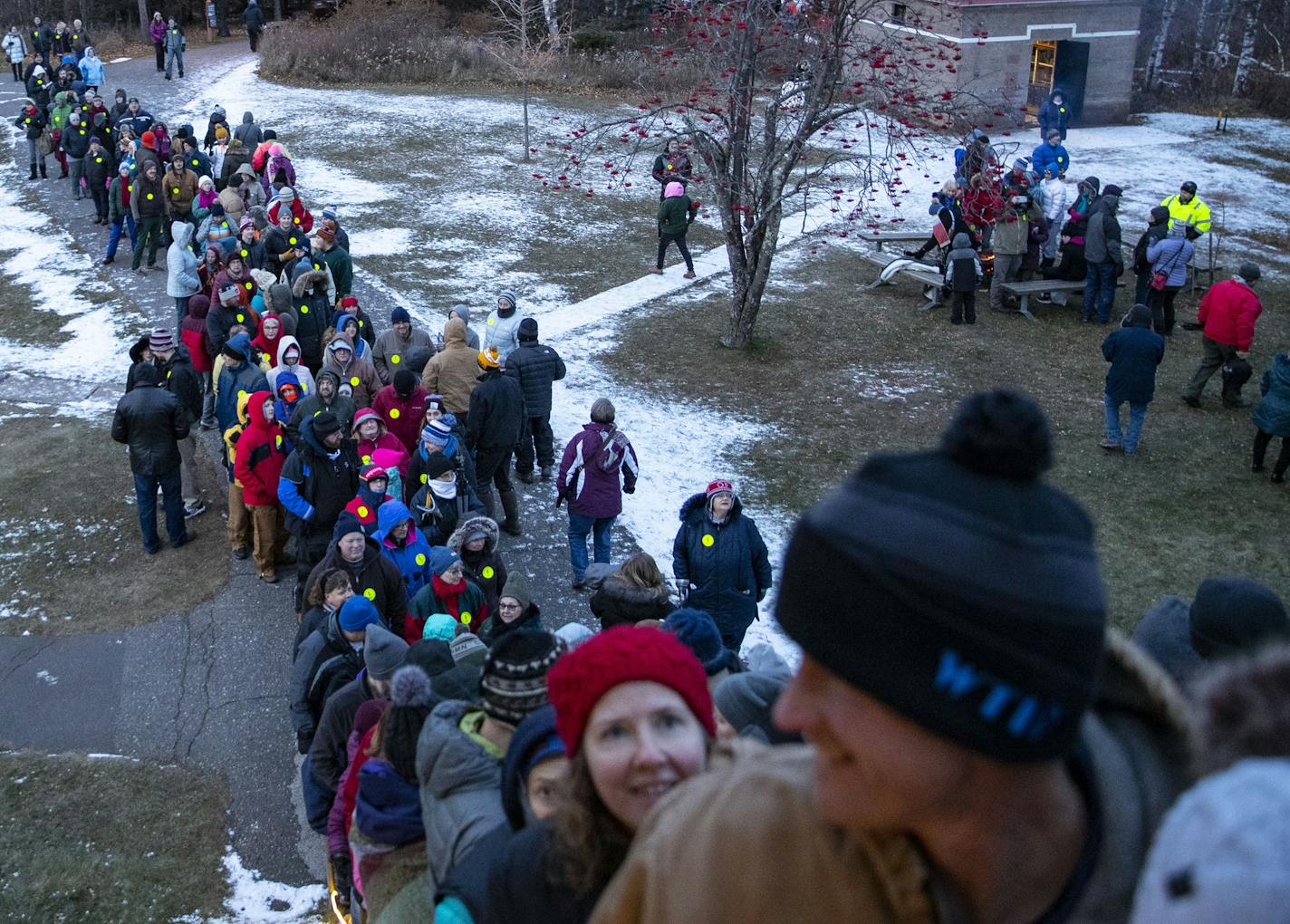 A long line of people braced the chilly weather on Sunday evening to get a chance to go inside the Split Rock Lighthouse once it was illuminated for the only night of the year.]
ALEX KORMANN &#x2022; alex.kormann@startribune.com The decommissioned Split Rock Lighthouse in Two Harbors, MN is lit once a year to honor the 29 men who died in the wreck of the Edmund Fitzgerald. On November 10, 2019 the 44th anniversary of the shipwreck was honored.