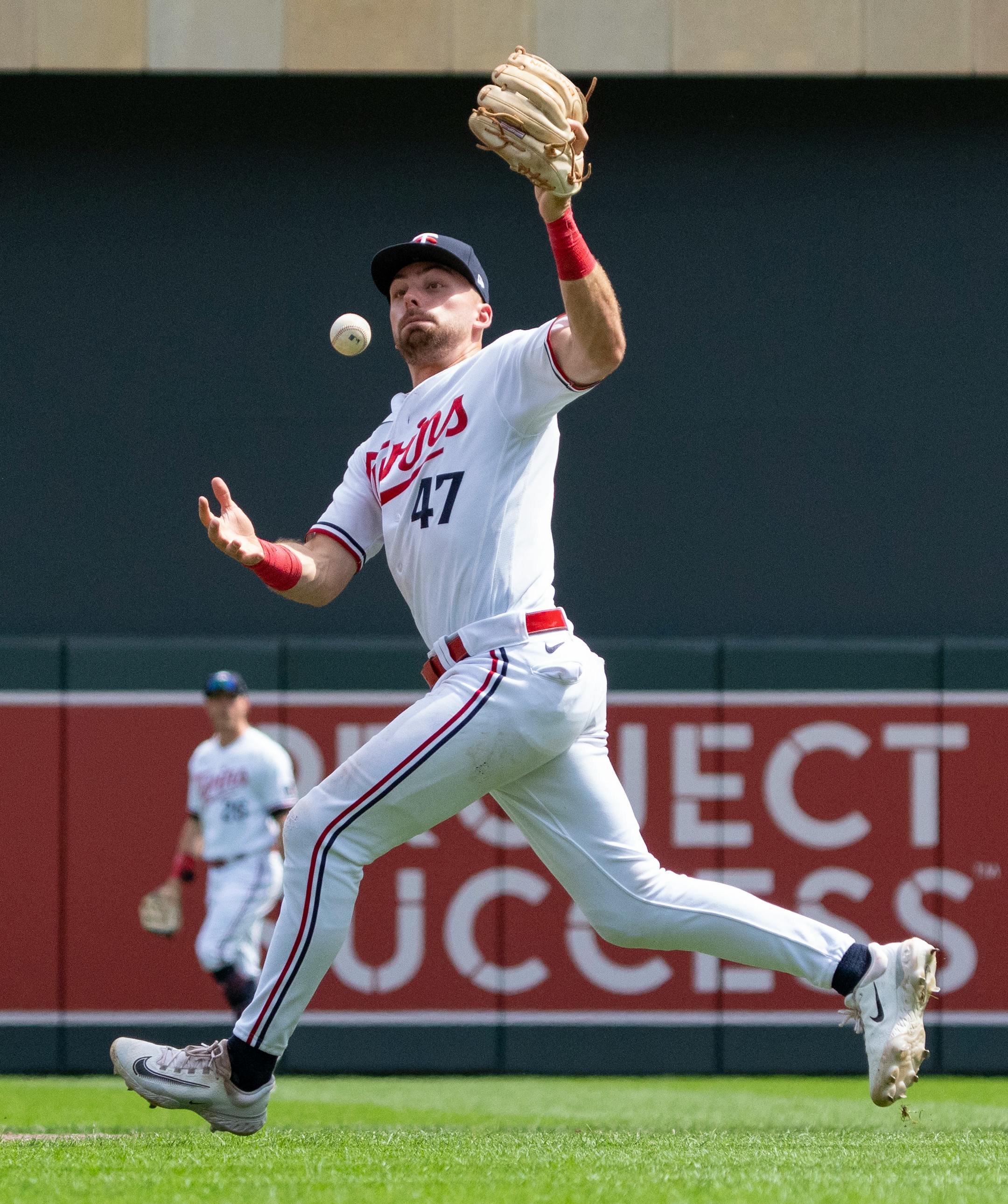 Minnesota Twins second baseman Edouard Julien (47) bobbles a catch attempt against the Detroit Tigers in the seventh inning.