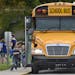 Students board buses at Frances Slocum Elementary School in Marion, Ind., after classes on Thursday, Aug. 16, 2018. Marion Community Schools is lookin
