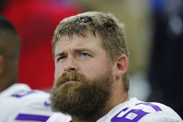 Minnesota Vikings offensive guard Joe Berger (61) watches against the Detroit Lions during an NFL football game in Detroit, Thursday, Nov. 23, 2017. (