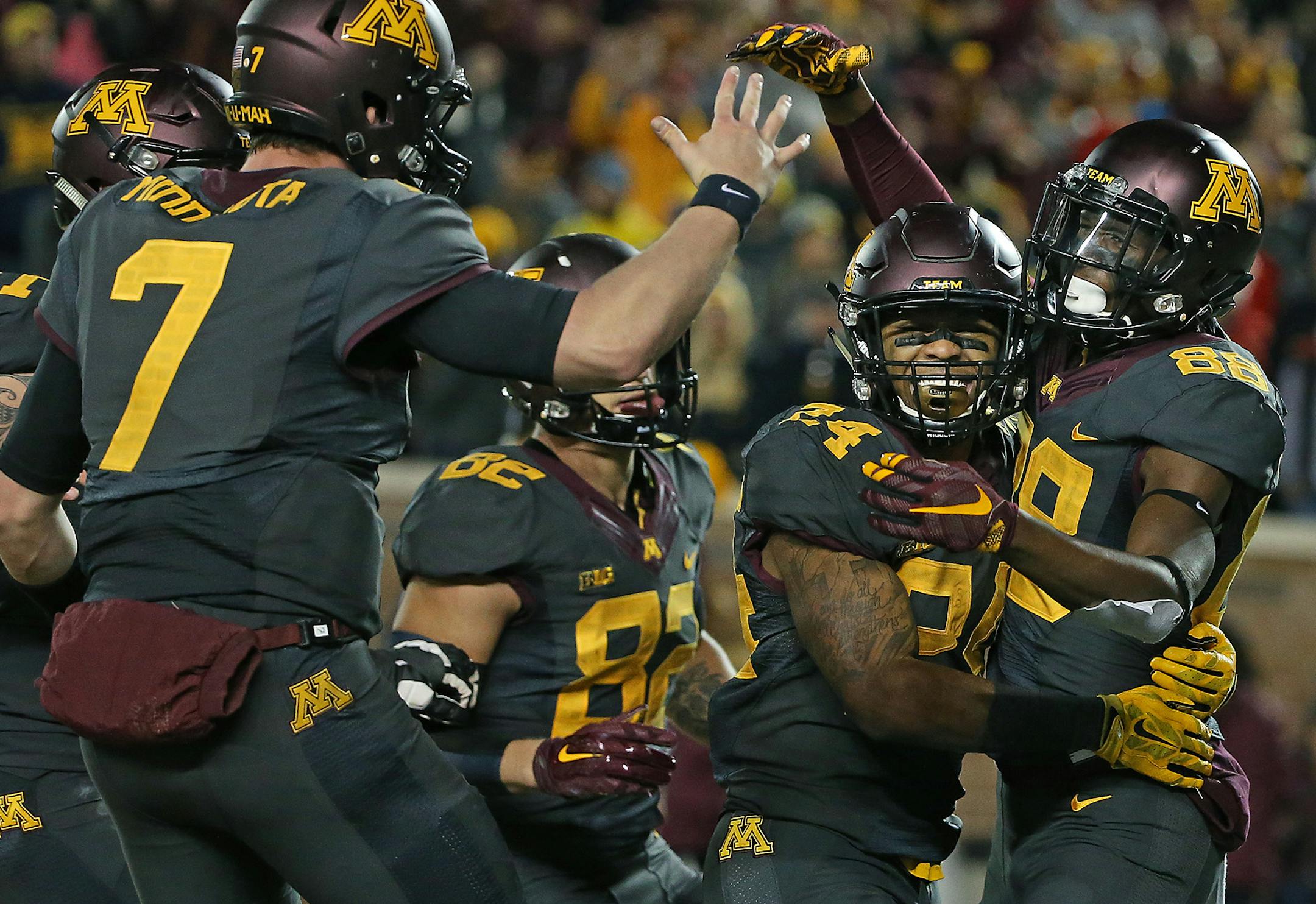 Minnesota’s wide receiver Rashad Still, right, celebrated a touchdown with teammates Mitch Leidner, left, and Rodney Smith, center, in the second quarter as Minnesota took on Michigan at TCF Bank Stadium, Saturday, October 31.