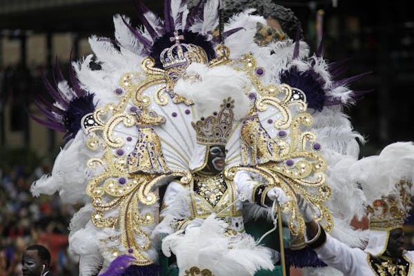 The King of Zulu, Anthony Tony Barker Sr., arrives on Canal St. on Mardi Gras Day in New Orleans, Tuesday, March 8, 2011.