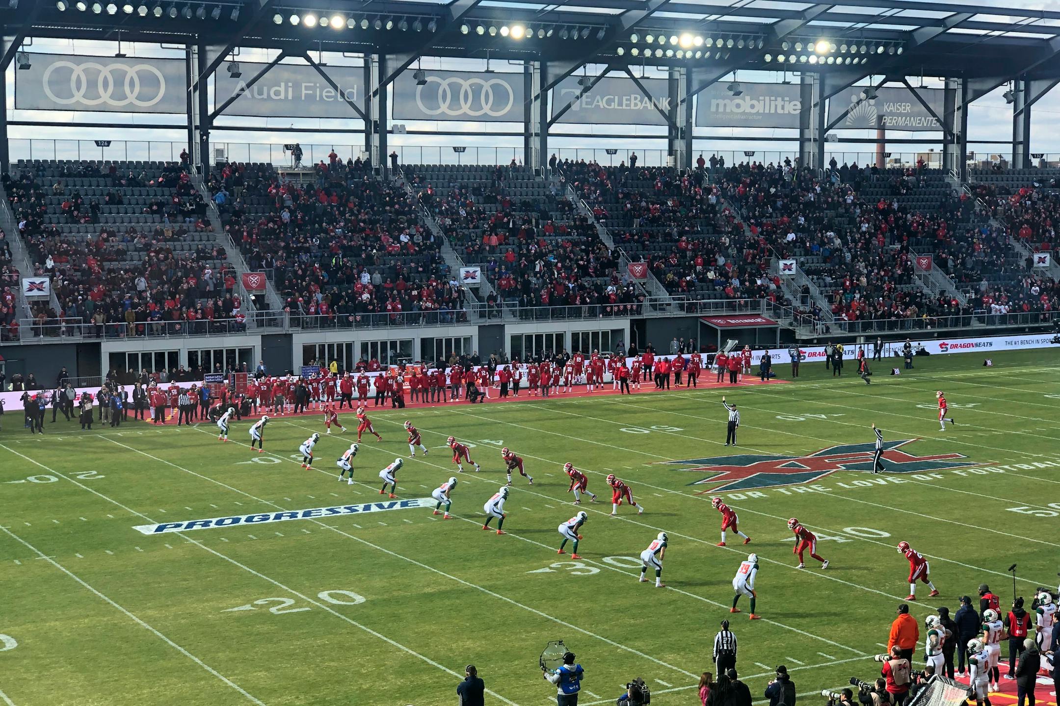 The D.C. Defenders, right, lined up against the Seattle Dragons for the opening kickoff of the opening football game of the XFL season
