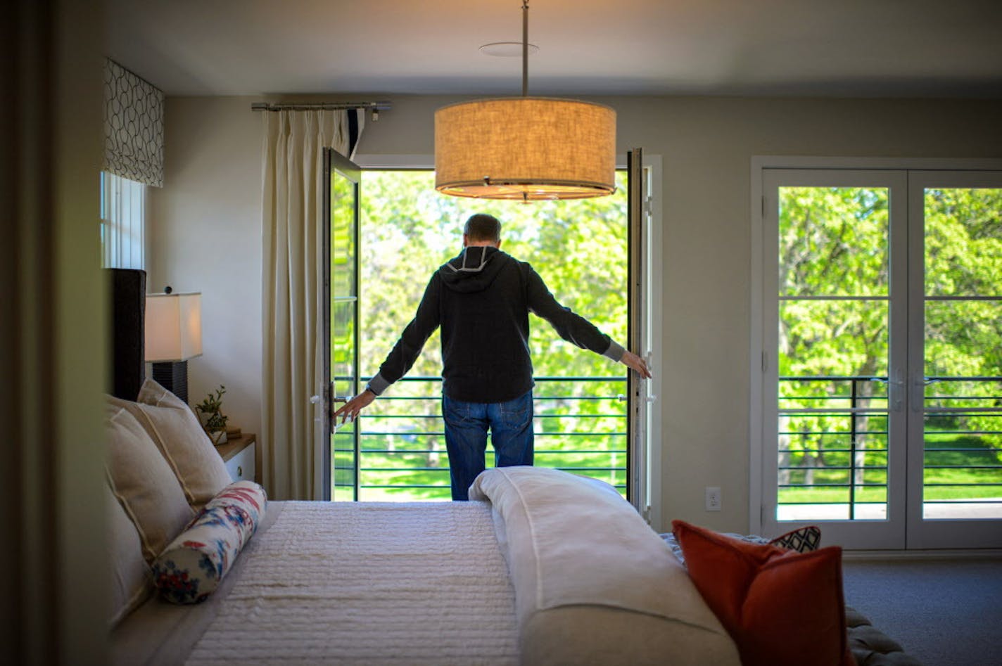 Double French doors in the second floor master bedroom. ] GLEN STUBBE * gstubbe@startribune.com Tuesday, May 17, 2016 Highlight from the upcoming Artisan Home Tour, a modern house in an established traditional neighborhood in Edina. This year's tour marks the return of the upper-bracket spec house; they all but disappeared when the housing market tanked. The builder Andy Porter is in some of the photos as is designer Bridget Burns of Blend Interior Design. Home is 6028 Oaklawn Ave. S., Edina, MN