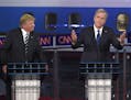 Republican presidential candidate, former Florida Gov. Jeb Bush, center, gestures as Donald Trump, left, and Scott Walker look on during the CNN Repub