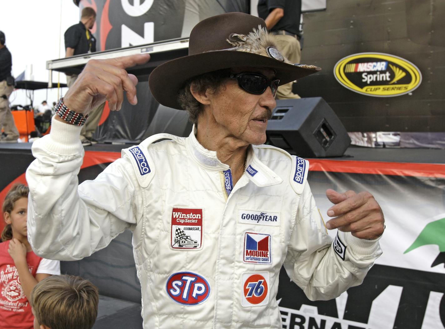 Former NASCAR driver Richard Petty wears a throwback driving suit to celebrate the 25th Anniversary of his 200th win prior to the Coke Zero 400 auto race at Daytona International Speedway in Daytona Beach, Fla., Saturday, July 4, 2009.(AP Photo/John Raoux)