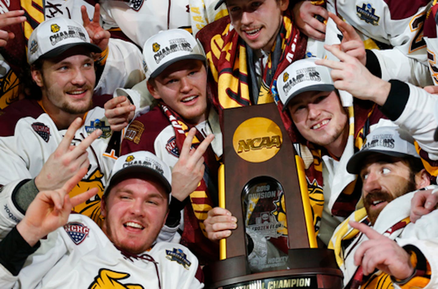 Minnesota-Duluth players celebrate a 3-0 victory over Massachusetts in the NCAA Frozen Four men's college hockey championship game Saturday, April 13, 2019, in Buffalo, N.Y. (AP Photo/Jeffrey T. Barnes)