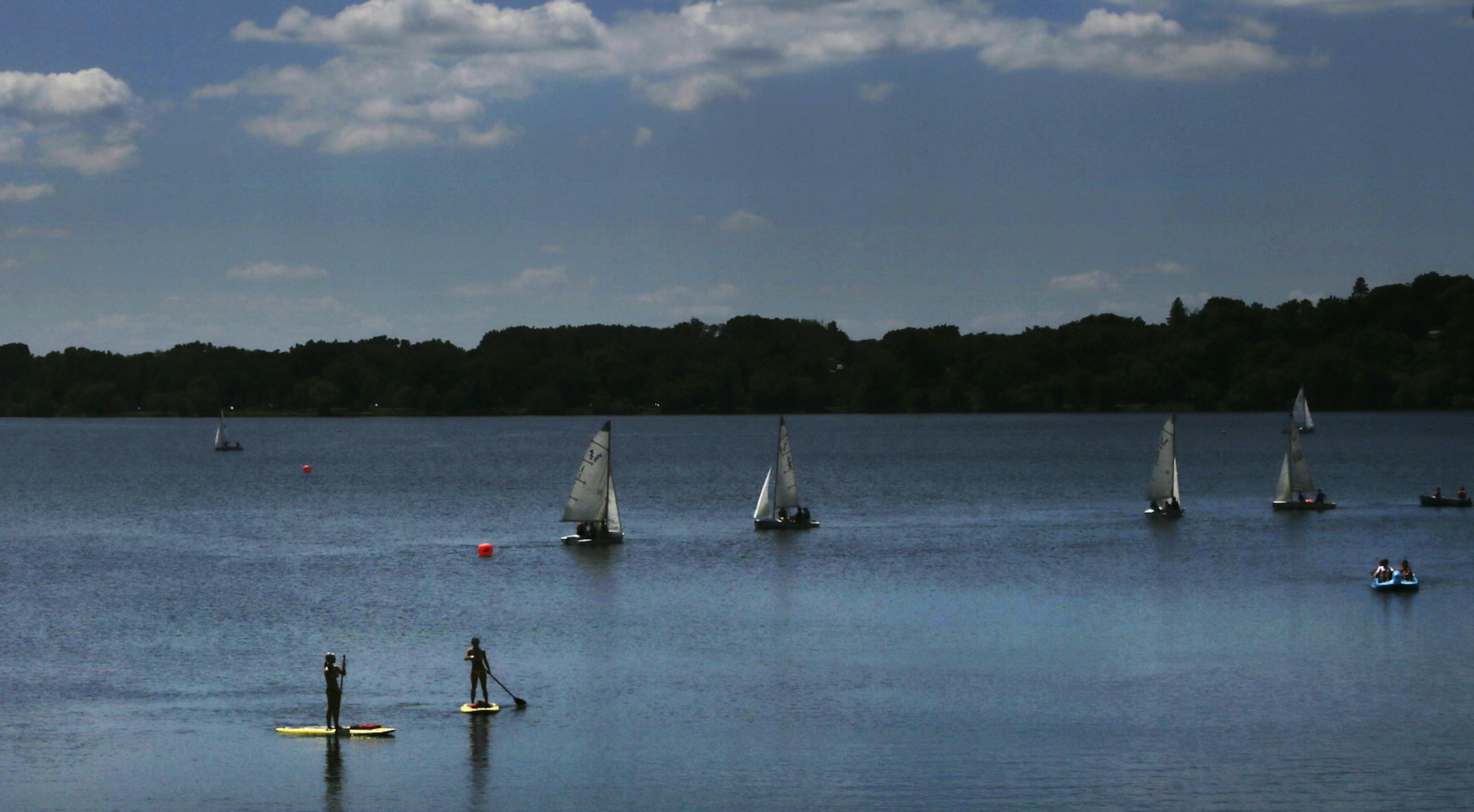 Water enthusiasts shared the waters of Lake Calhoun under sunny skiesThursday, June 13, 2013, in Minneapolis, MN.](DAVID JOLES/STARTRIBUNE) djoles@startribune.com Thursday proved to be one of the first legitimately warm, sunny days thus far this spring and people took advantage of it on Lake Calhoun. ORG XMIT: MIN1306131458386650