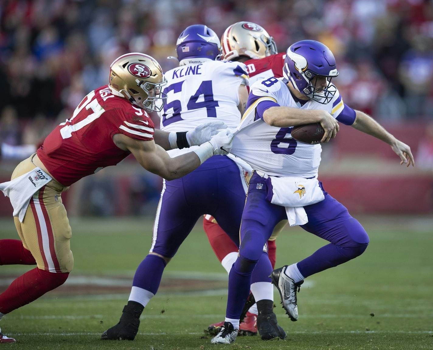 San Francisco 49ers defensive end Nick Bosa (97) sacked Minnesota Vikings quarterback Kirk Cousins (8) in the fourth quarter .