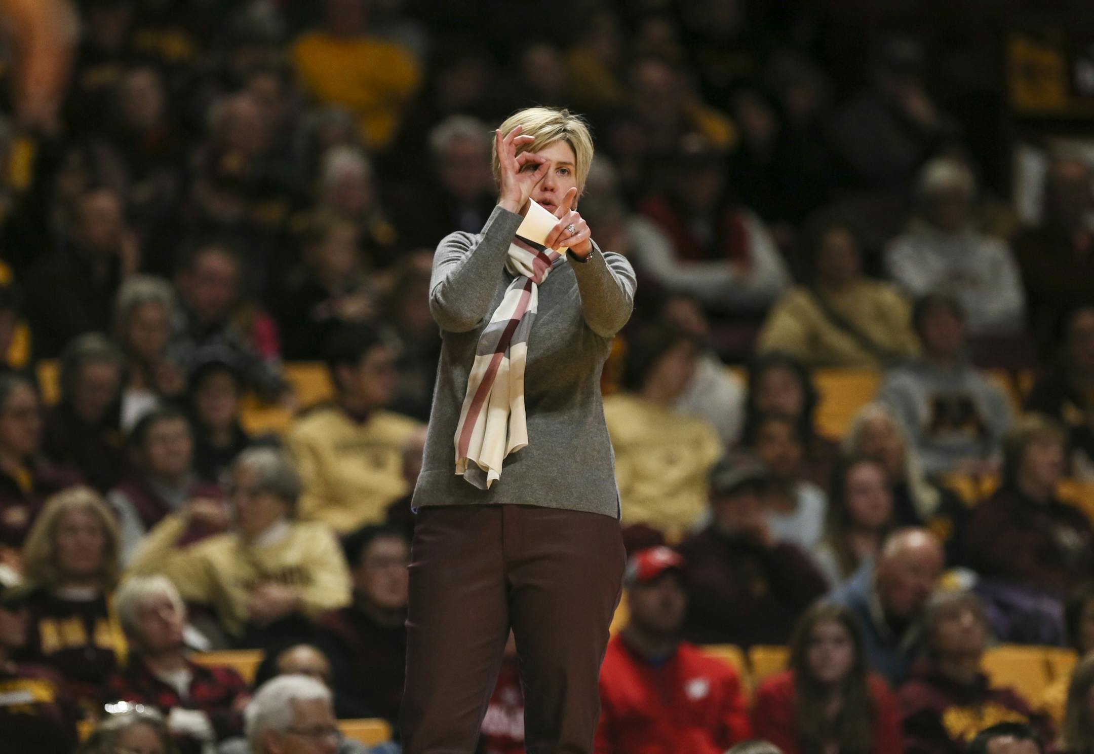 Gophers head coach Marlene Stollings signaled to the team in the second half.