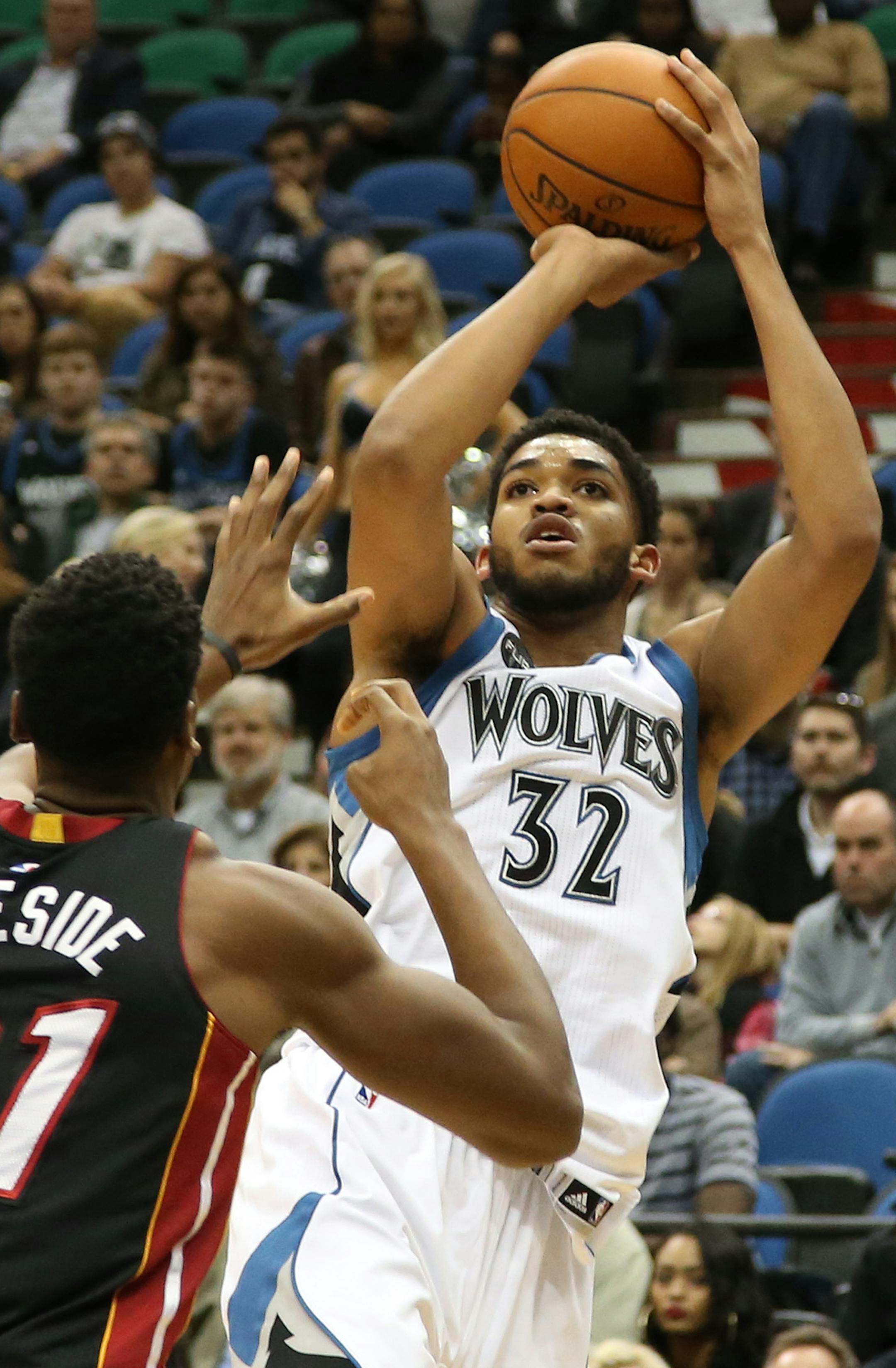 Wolves Karl-Anthony Towns made the pull up jumper over Miami's Hassan Whiteside during the first half. ] (KYNDELL HARKNESS/STAR TRIBUNE) kyndell.harkness@startribune.com Wolves vs Miami at the Target Center in Minneapolis Min., Thursday November 5, 2015.