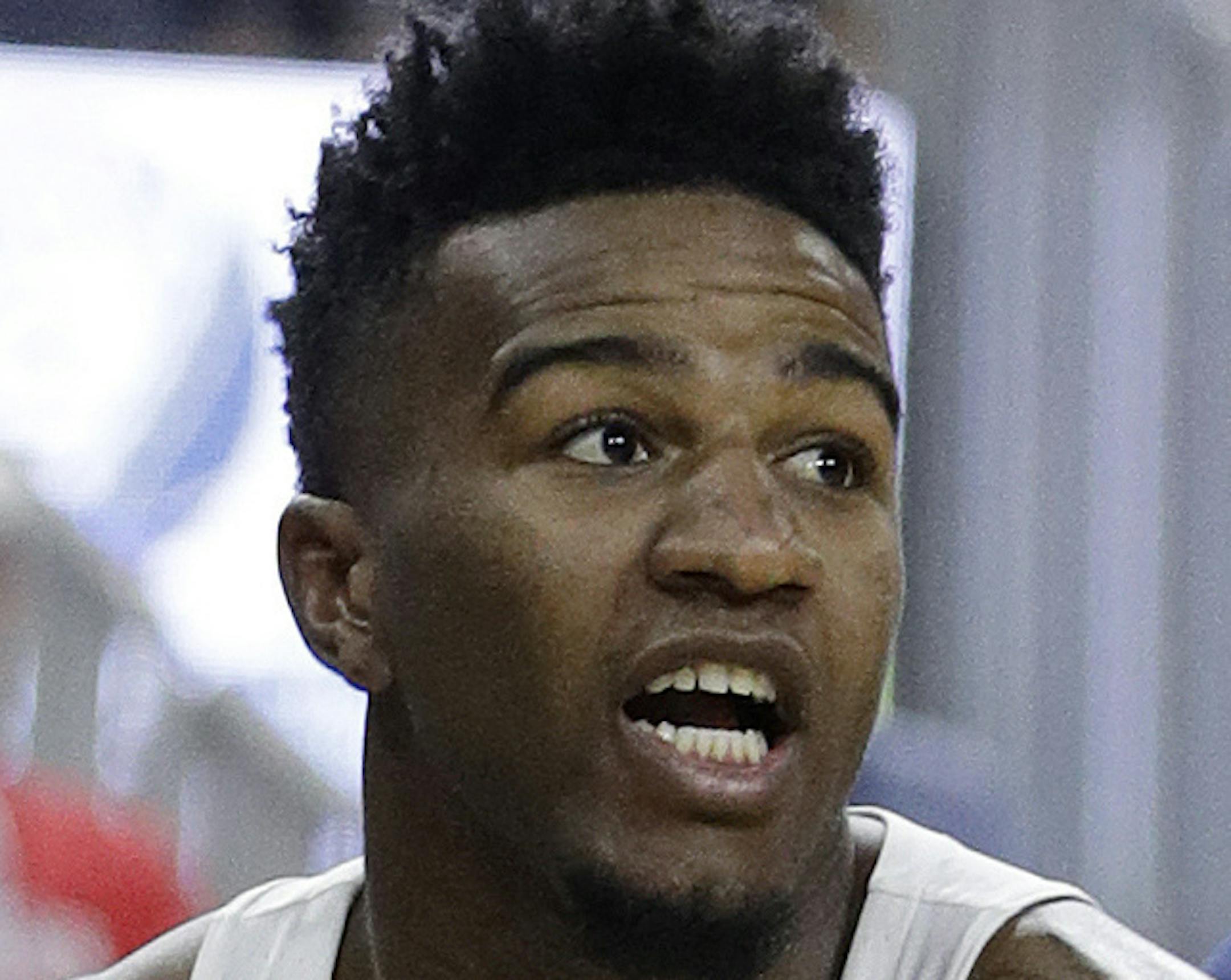 Oregon's Jordan Bell drives around Arizona's Lauri Markkanen during the first half of an NCAA college basketball game for the championship of the Pac-12 men's tournament Saturday, March 11, 2017, in Las Vegas. (AP Photo/John Locher)