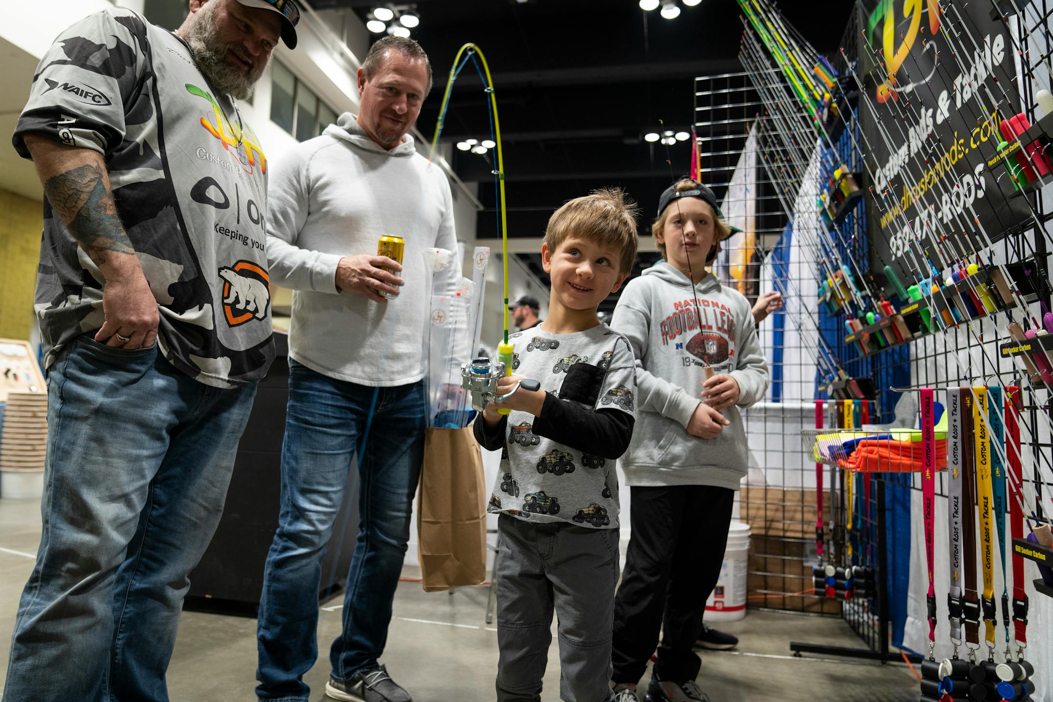 Cruz Duerschmidt, 5, of Otsego tries out a rod at DH Custom Rods and Tackle at the St. Paul Ice Fishing and Winter Sports Show in St. Paul, Minn. Friday, Dec. 1, 2023. ] LEILA NAVIDI • leila.navidi@startribune.com