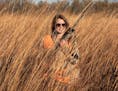 Abby Stone, 27, of Des Moines, Iowa, who learned to hunt pheasants after moving to Iowa from Illinois to attend college, isn't a diehard basketball fa