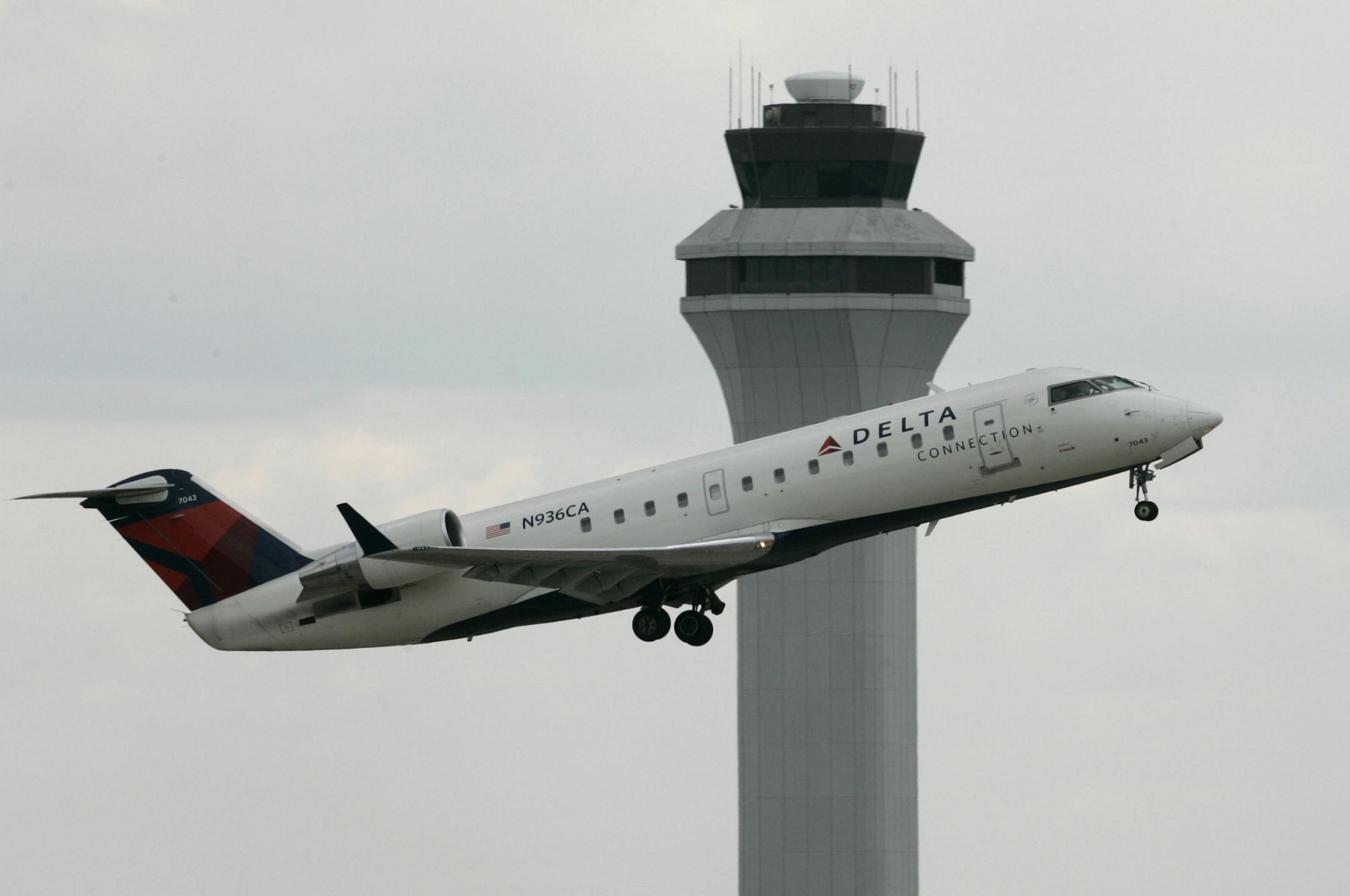 In this April 14, 2008 file photo, a Delta jet takes off past the control tower at the Greater Cincinnati Northern Kentucky International Airport in Hebron, Ky. Delta Air Lines Inc., the nation's third-largest carrier, on Wednesday, April 23, 2008 said its loss widened in the first quarter to a whopping $6.39 billion because of soaring fuel prices and the steep decline in the company's market value.