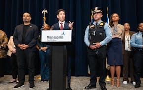 Minneapolis Jacob Frey, center, and Police Chief Brian O’Hara, right, address the dismissal of the federal consent decree during a press conference