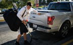 Totino-Grace freshman Luke Rooker grabbed his hockey gear from his father's truck as he walked into the Brooklyn Park Community Center ice arena for p