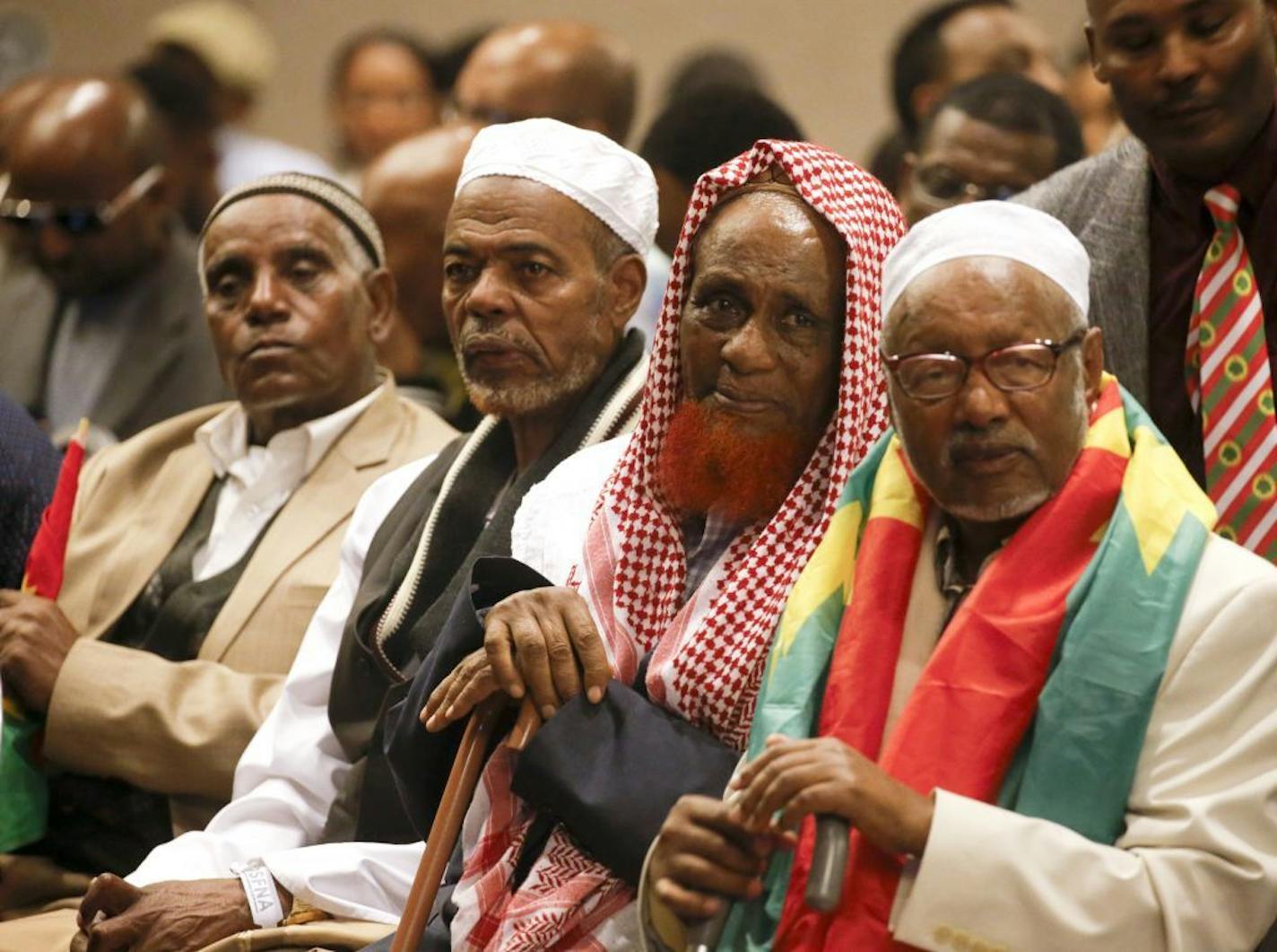 Oromo elders waited for the entrance of Oromo (Ethiopian) Olympian Feyisa Lilesa. They are from left, Osman Kadro, Rashid Sala, Hajs Kasim and Ahamed Tamari. The event was at the Minneapolis Convention Center, Sunday, Sept 18, 2016. A crowd of about 1000 well wishers greeted the Olympian, who won the silver medal in the 2016 Games in Rio and crossed the finish line with his arms crossed in an X, symbolizing the plight of the Oromo in Ethiopia. 2016