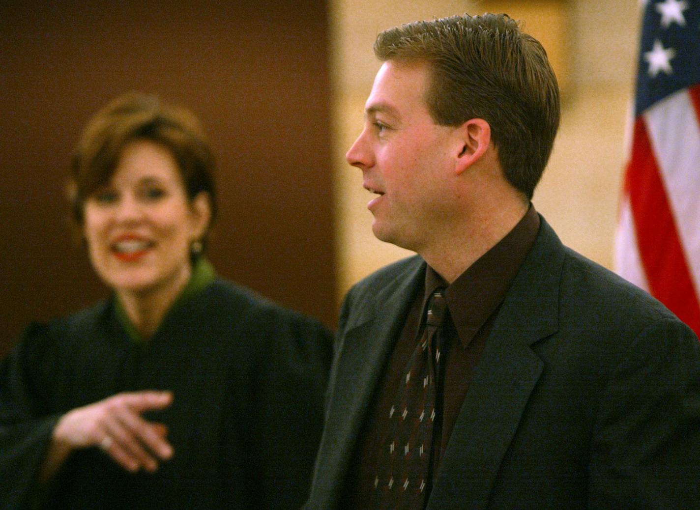 St. Paul, MN Tues 1/07/2003 Chief Judge Blatz ( left) jokes with Senator Dan Sparks after administering a ceremonial oath of office as he heads for the Senate Chamber for the official swearing in. Sparks eventually won the contested election by 5 votes, after 17 ballotts that had been burned were discounted.