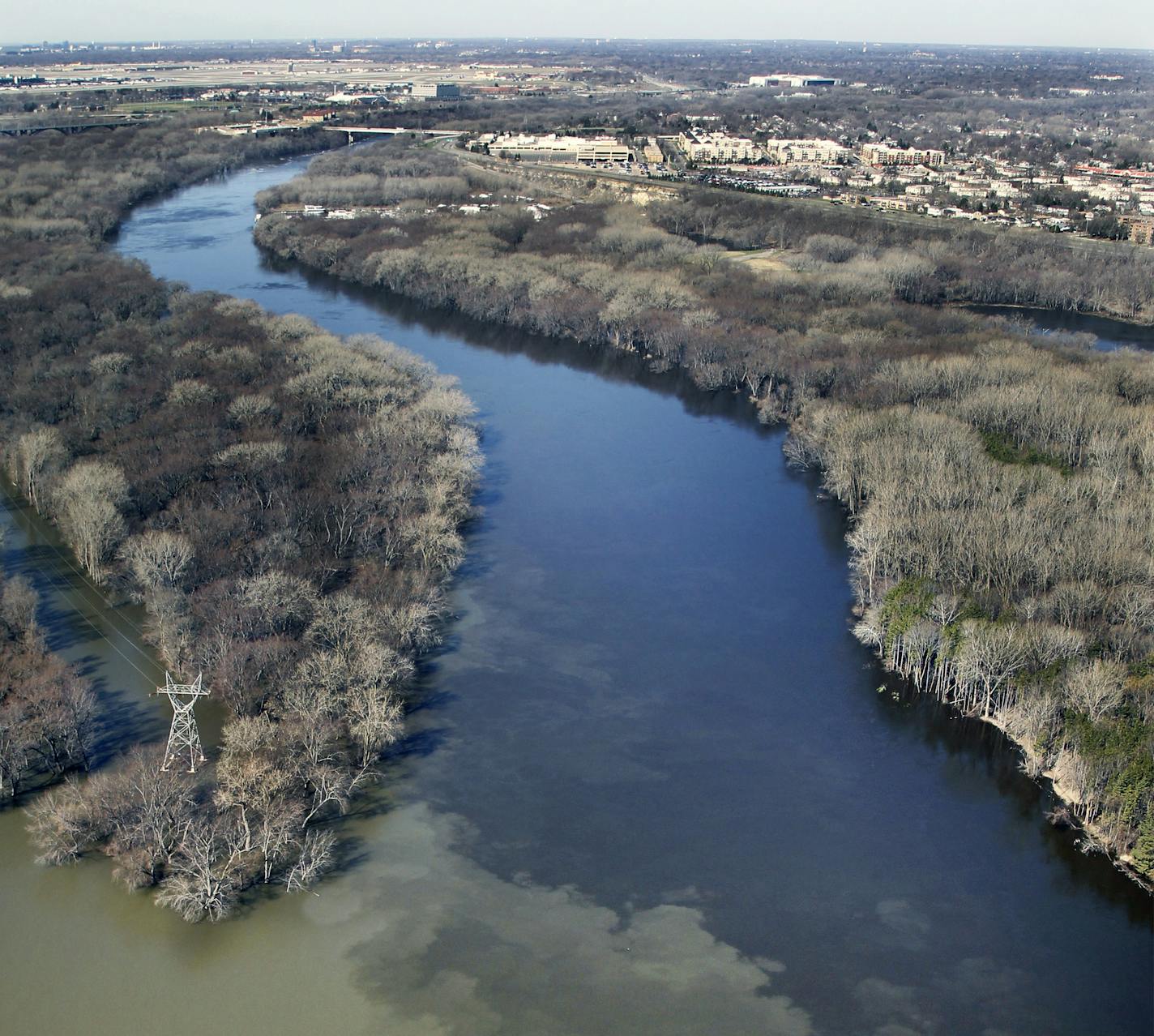 The sediment flowing out of the Minnesota River (left) is obvious in this photo of the confluence of the Minnesota and Mississippi (Right) Rivers near Fort Snelling (2011 File photo by Brian Peterson). brian.peterson@startribune.com