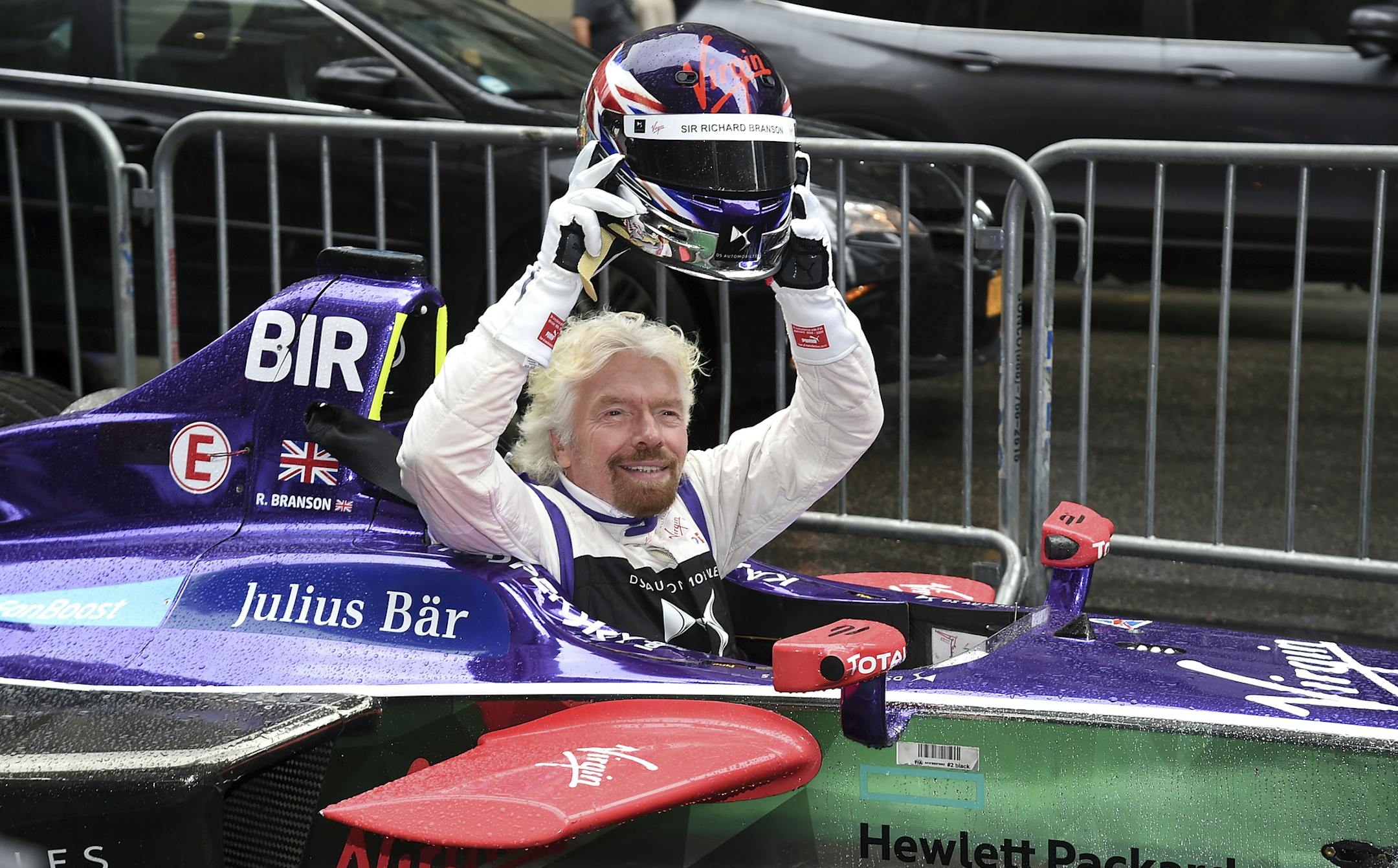 Sir Richard Branson poses on Fifth Avenue with a DS Virgin Racing Formula E Car before ceremonially lighting the Empire State Building in celebration of the inaugural New York City ePrix race on Friday, July 14, 2017, in New York. (Photo by Evan Agostini/Invision/AP)