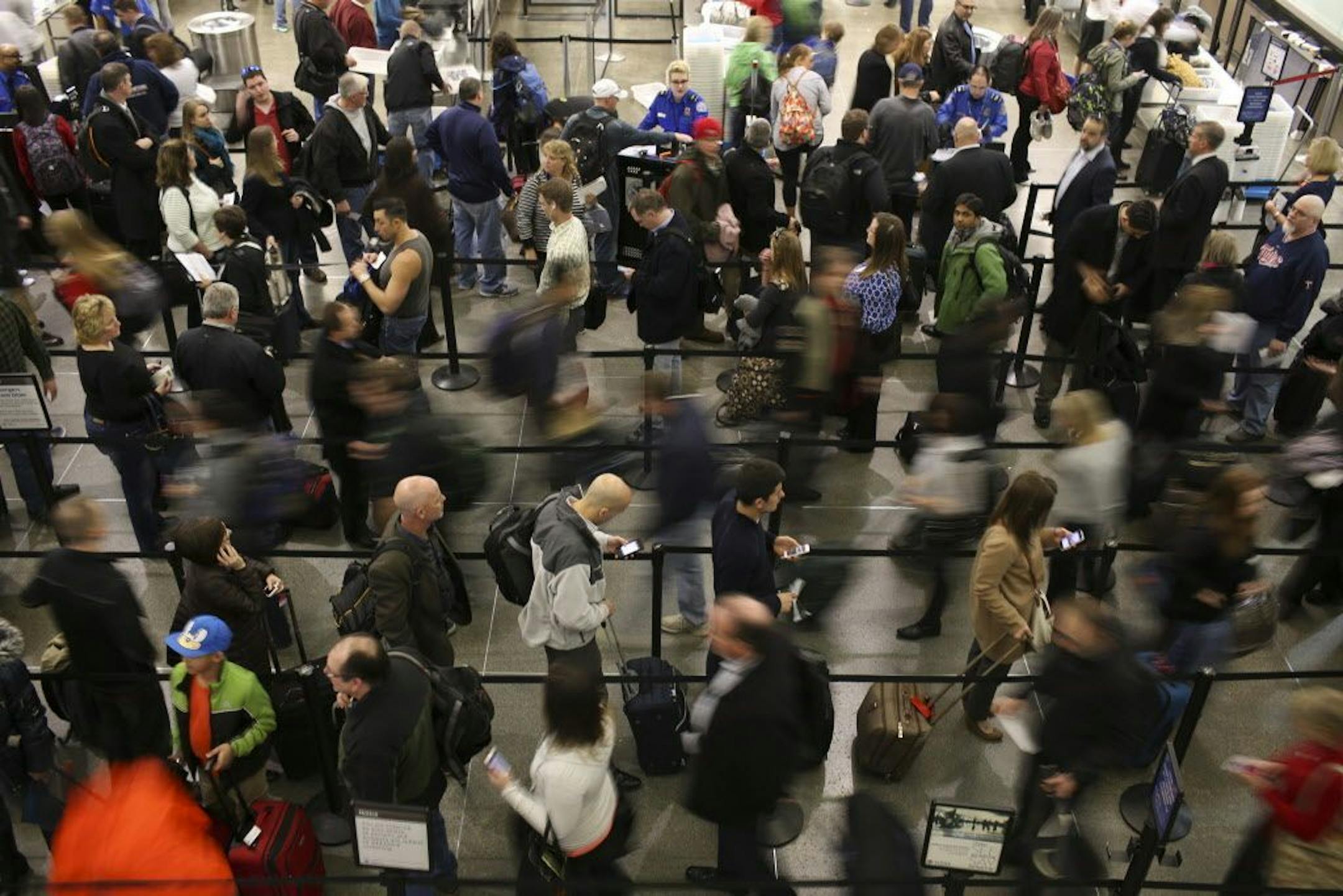 Air travelers waited in line to go through TSA security screening at MSP.