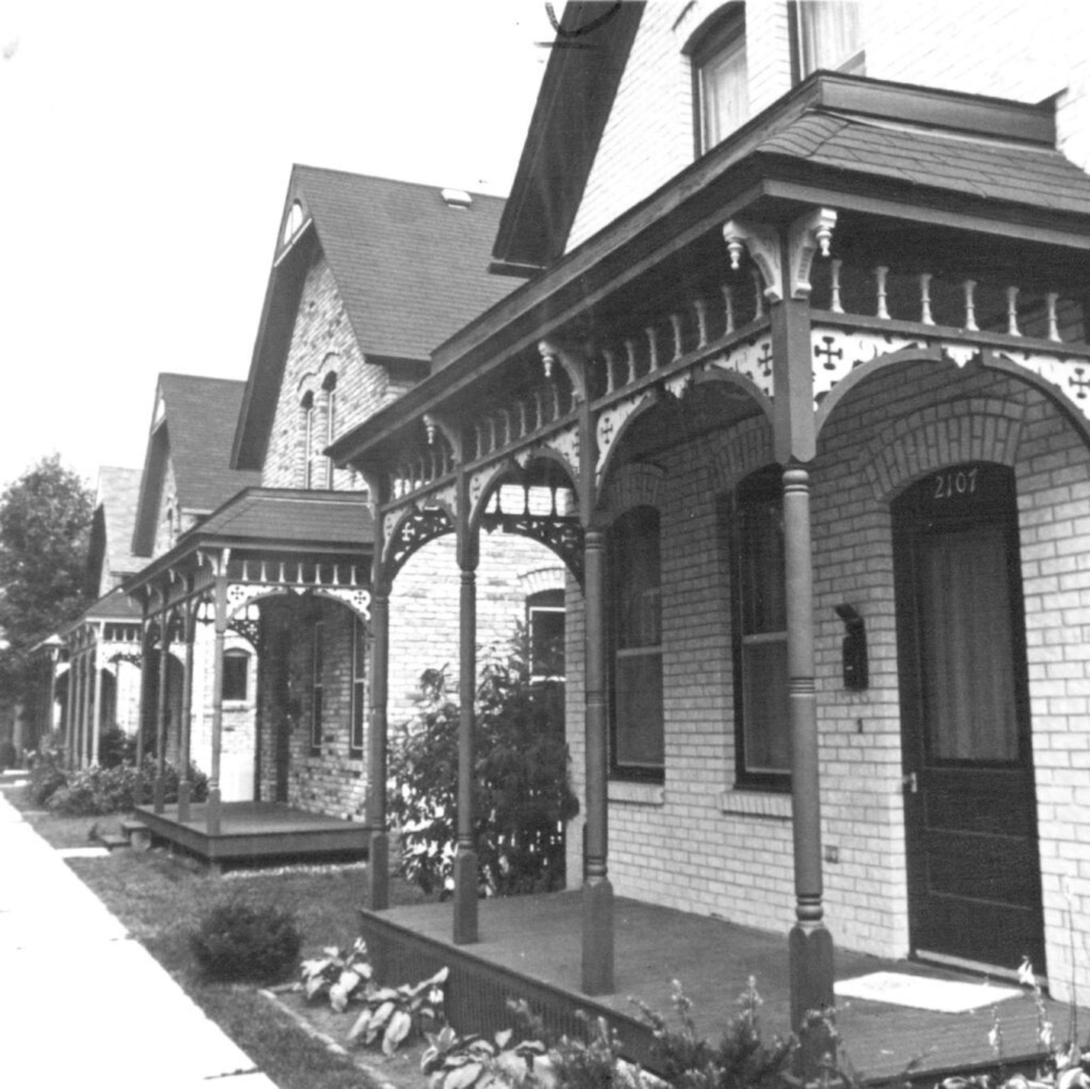 December 25, 1983 Restored "lookalike" houses on Milwaukee Avenue in Minneapolis, occupied in the late nineteenth and early twentieth centuries by Scandinavian immigrants, recalled their original charm in 1983. Prompt action by preservationists saved the badly deterioated dwellings when they were scheduled for destruction in 1970. The houses were built on half lots facing an alley between Twenty-second and Twenty- third avenues south, formerly called Twenty-second-and-a- half Avenue. During the