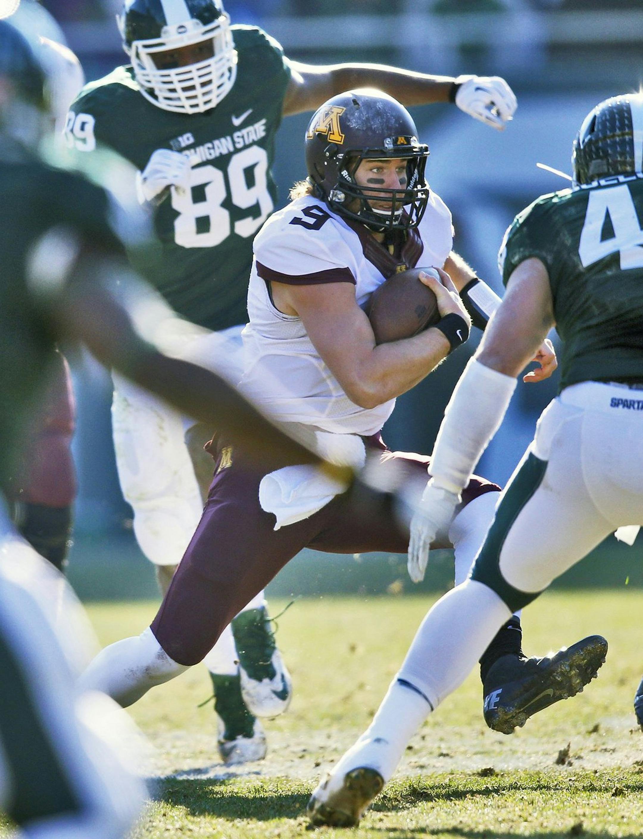 Minnesota quarterback Philip Nelson is hemmed in by the Michigan State defense in the first half at Spartan Stadium in East Lansing, Mich., on Saturday, Nov. 30, 2013. Michigan State won, 14-3. (Marlin Levison/Minneapolis Star Tribune/MCT) ORG XMIT: 1146217