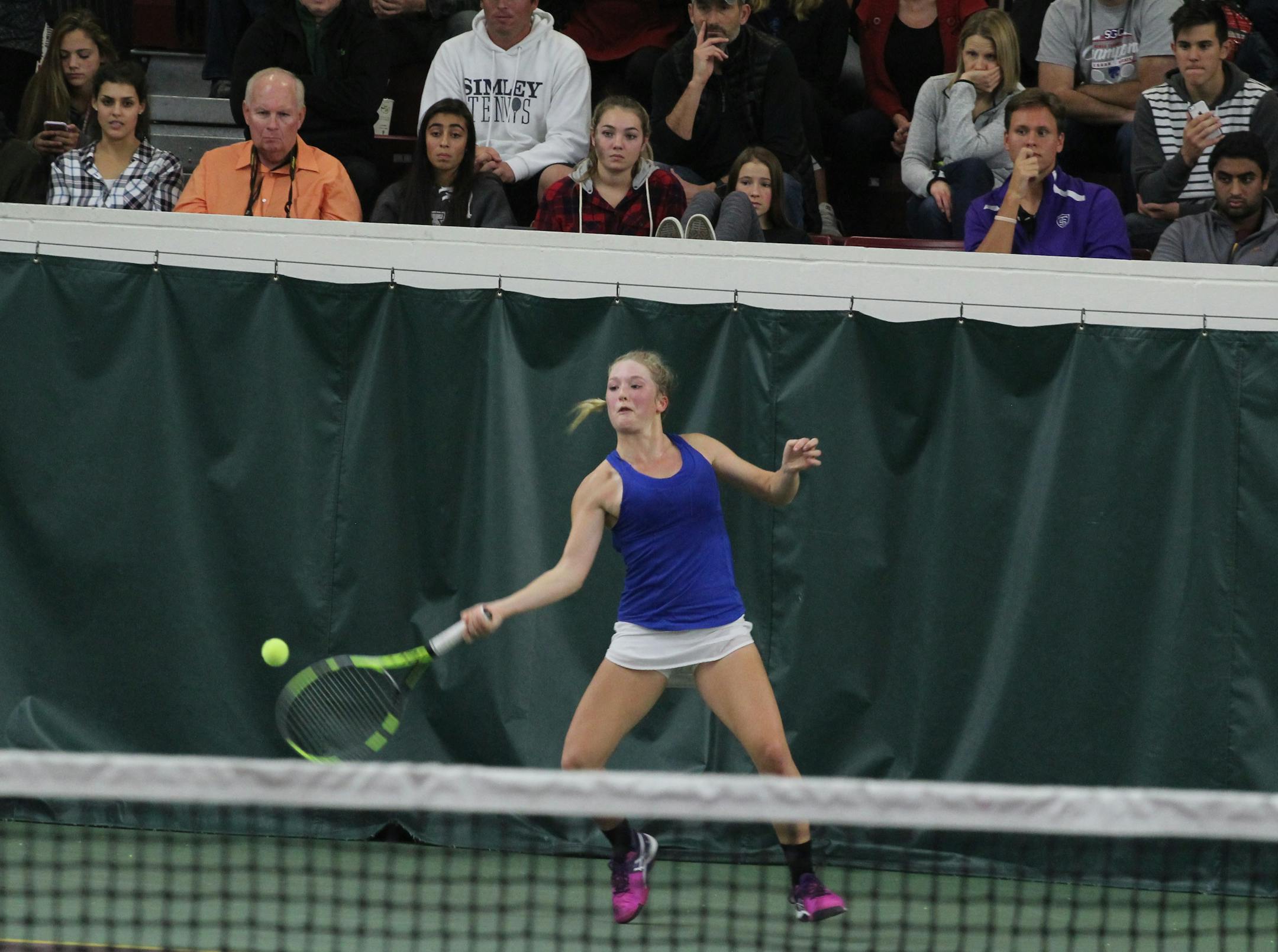 Minnetonka's Bella Lambert, shown in her Class 2A singles match against Edina's Sophia Reddy, got some advice beforehand from her older sister, Aria, seated far left in the front row behind her at Baseline Tennis Center. "She told me some basic things like never give up on a point and don't think about the bigger picture. Take it one point at a time," Bella said.