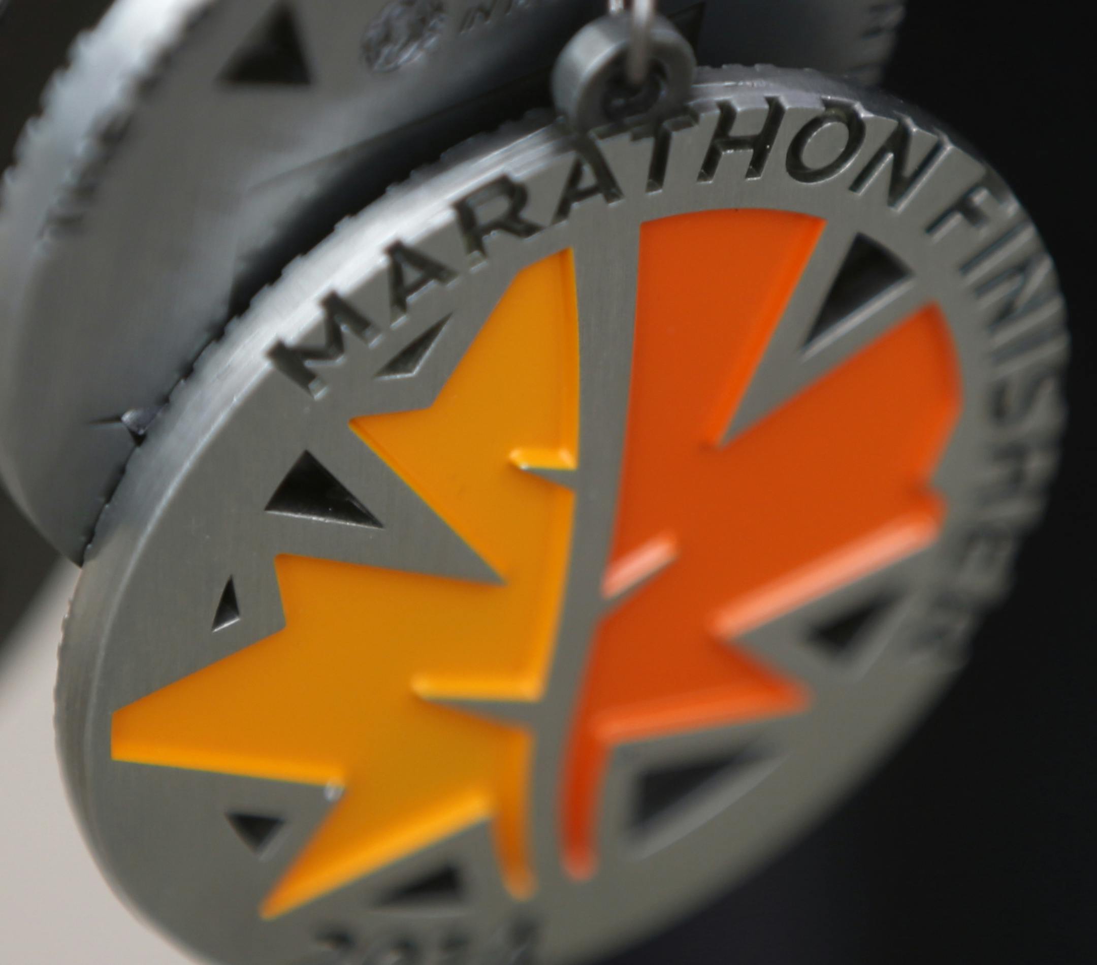 This year's medal for the marathon finishers.] On October 5, 2014 at the Twin Cities Marathon in St. Paul.Richard Tsong-Taatarii/rtsong- taatarii@startribune.com