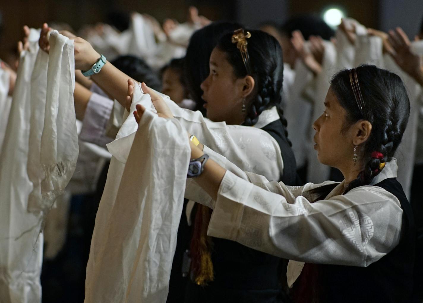 At the Minneapolis Convention Center, the Dalai Lama addressed a mostly Tibetan audience as part of a stay in Minnesota that includes visiting the Mayo Clinic for his health treatment. Children offered shawls in a dance to the spiritual leader.] Richard Tsong-Taatarii/rtsong-taatarii@startribune.com