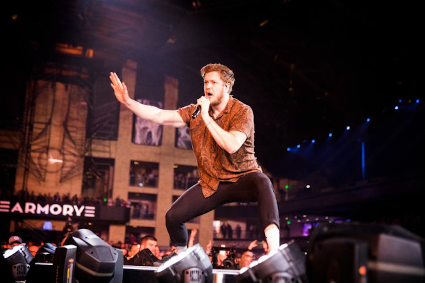 The Armory's facade made for a dramatic backdrop whenever Imagine Dragons singer Dan Reynolds worked the thrust stage Thursday night. / Leila Navidi, Star Tribune