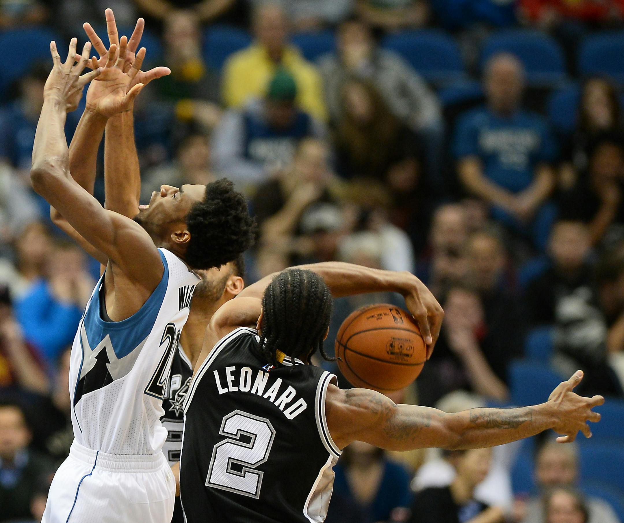 Wolves guard Andrew Wiggins, left, was blocked by Spurs forward Kawhi Leonard in the first quarter of San Antonio's 108-83 victory at Target Center on Dec. 23.