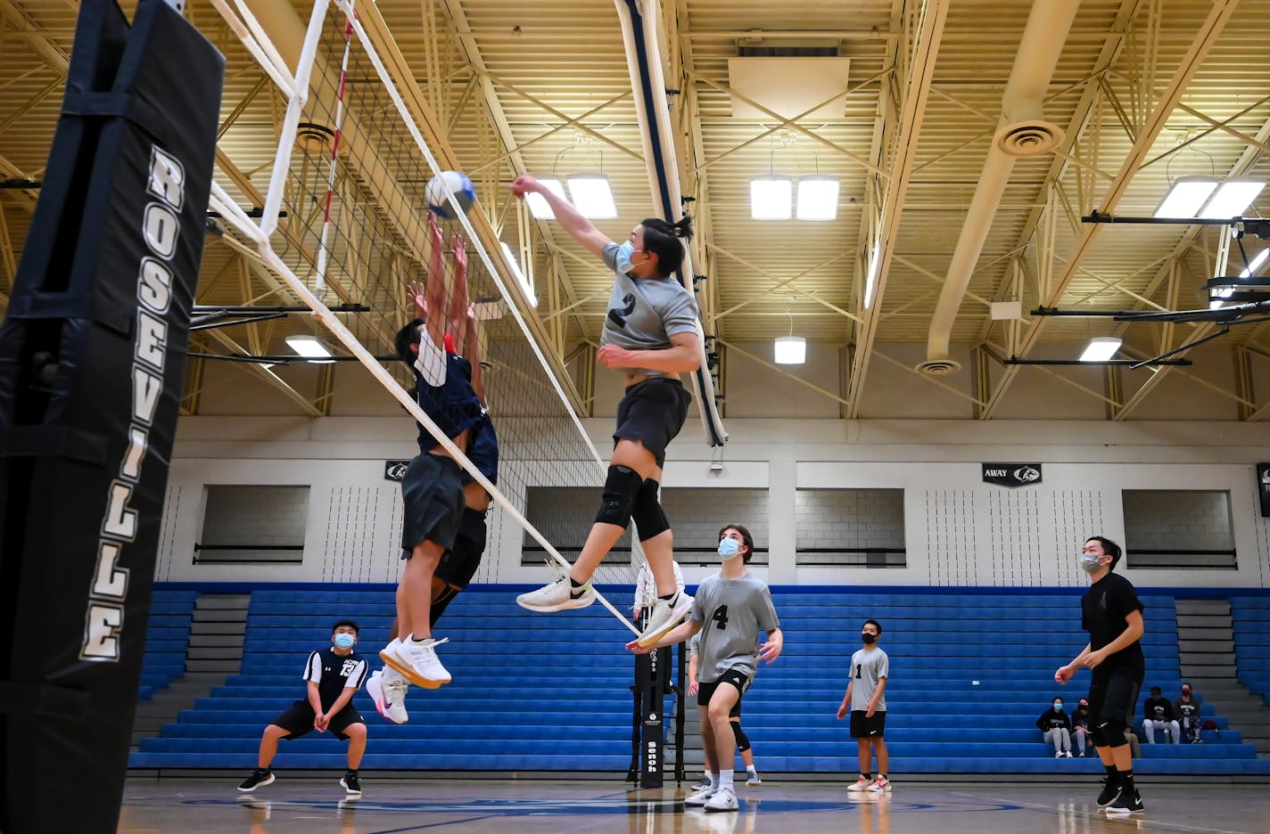 Pengsu Thao spiked the ball against Hmong Prep Academy players late in the third and final set of Wednesday night's match.