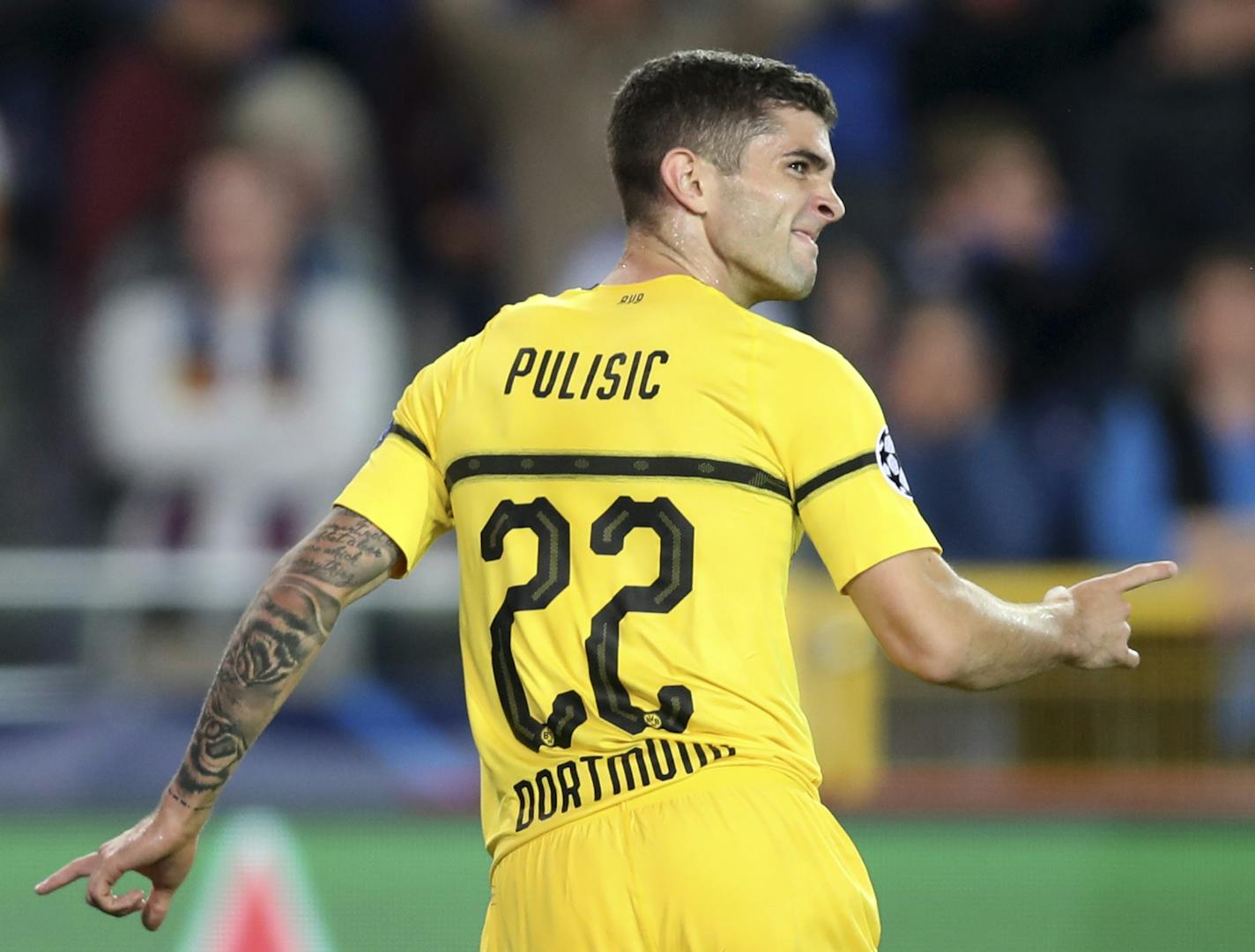 American Christian Pulisic celebrates scoring Borussia Dortmund's first goal during a Champions League group A soccer match between Club Brugge and Borussia Dortmund in September.