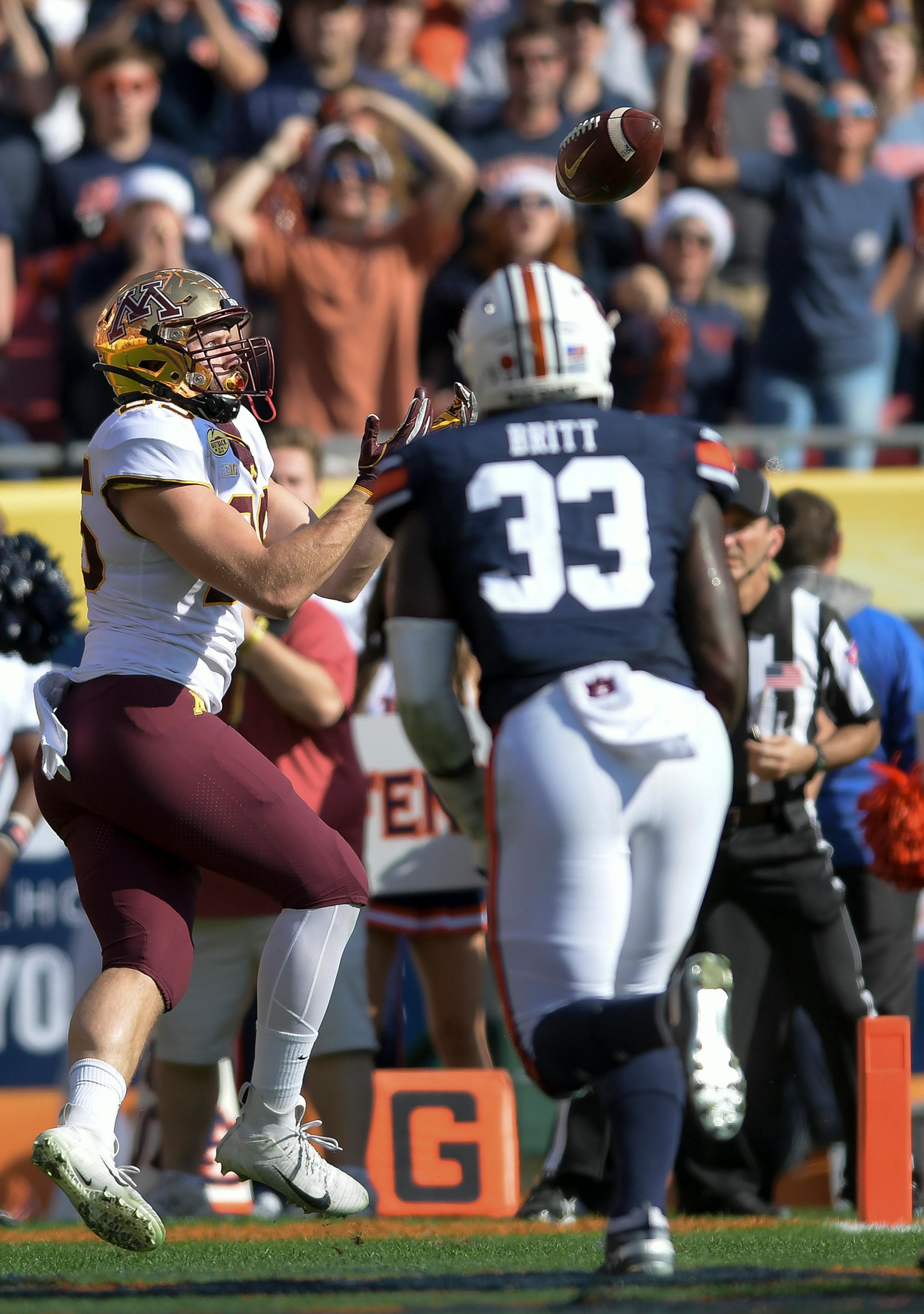 Minnesota Gophers tight end Bryce Witham (85) scored a touchdown off a pass by wide receiver Seth Green (17) in the second quarter against the Auburn Tigers.
