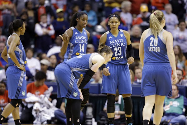 Members of Minnesota Lynx pause in the second half of Game 4 of the WNBA Finals basketball series against the Indiana Fever, in Indianapolis, Sunday, 