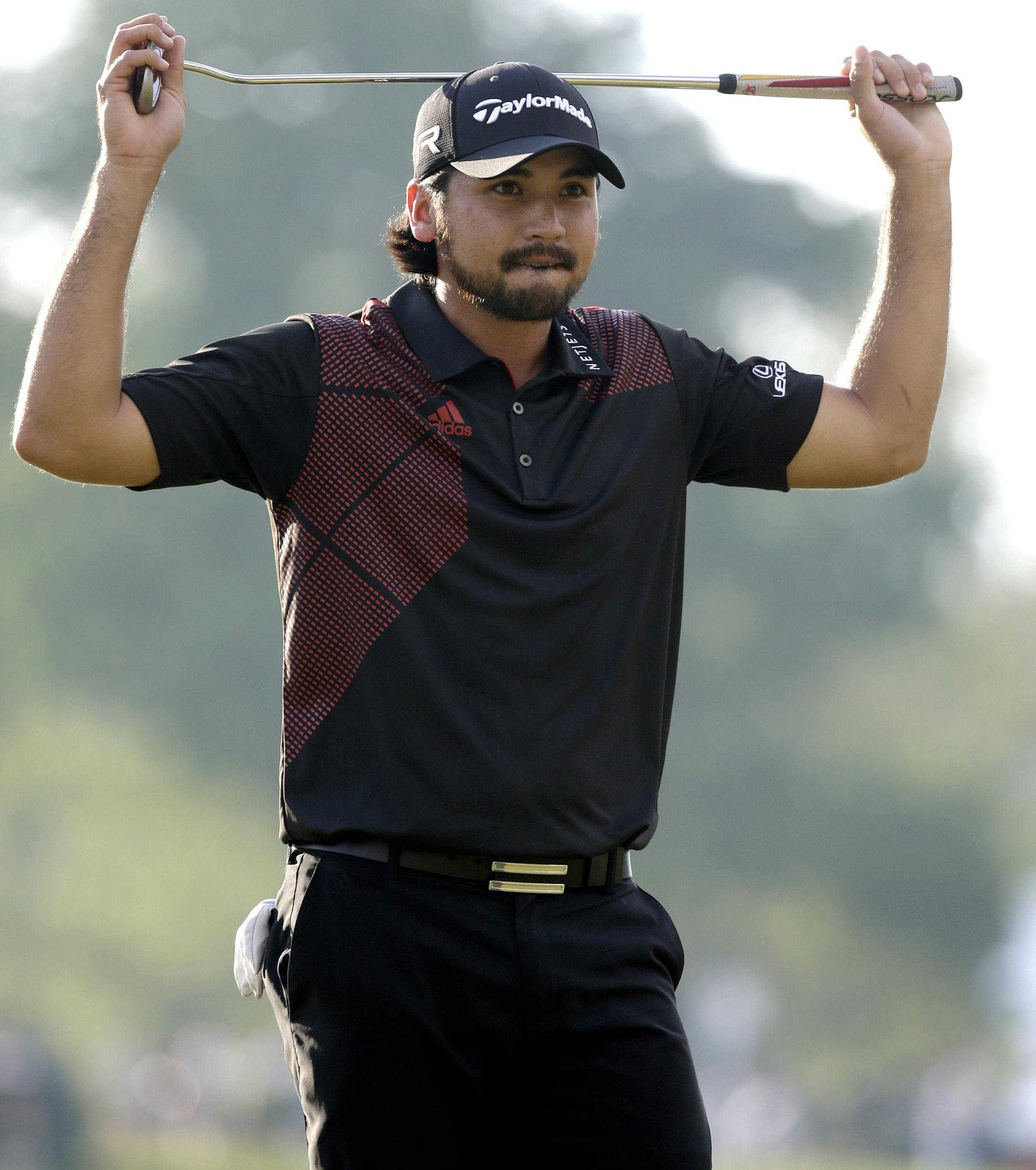 Jason Day, of Australia, reacts after a putt on the 18th hole during the fourth round of the U.S. Open golf tournament at Merion Golf Club, Sunday, June 16, 2013, in Ardmore, Pa. (AP Photo/Morry Gash)
