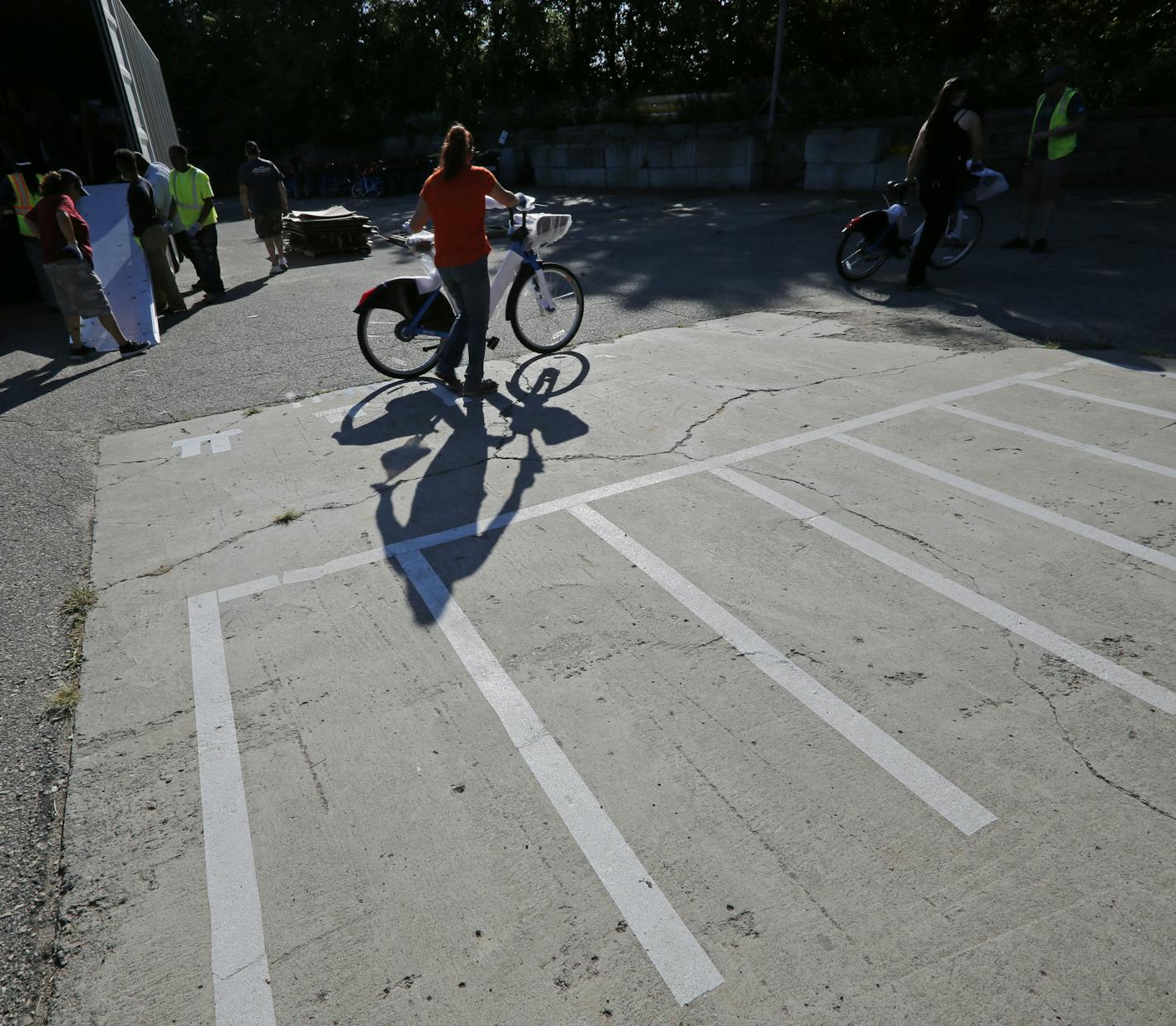 Bicycle parking hubs like the one seen here will be implemented around Minneapolis as a place for riders to return new dockless bikes. According to Melissa Summers with Nice Ride Minnesota, over 450 of the parking hubs have been placed around the University of Minnesota campus. ] Shari L. Gross &#xef; shari.gross@startribune.com The telltale blue dockless bikes are slated to arrive in Minneapolis on Tuesday, Sept. 18. The city has contracted with Motivate, a New York-based bike sharing firm, to