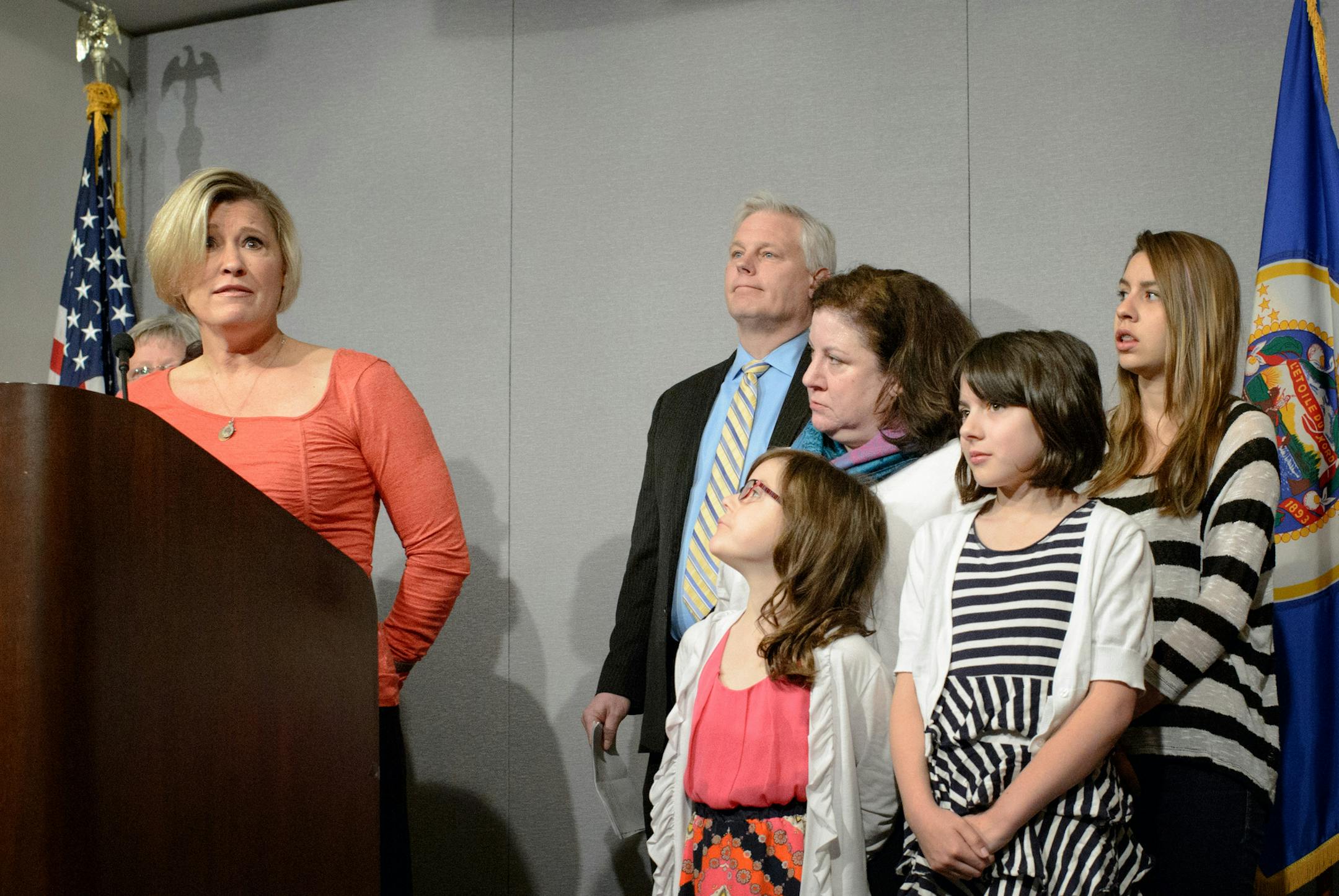 House Minority Leader Paul Thissen brought together people he called average Minnesotans who are left behind by the House Republican budget plan, including Nancy Swanson, a server at the Green Mill in Willmar, left and Monica Hass, a St. Paul mother who was joined by her 3 children, right. He said the plan would result in teacher layoffs, wage cuts for working Minnesotans, higher tuition, and more expensive health care coverage. ] GLEN STUBBE * gstubbe@startribune.com Monday, April 20, 2015